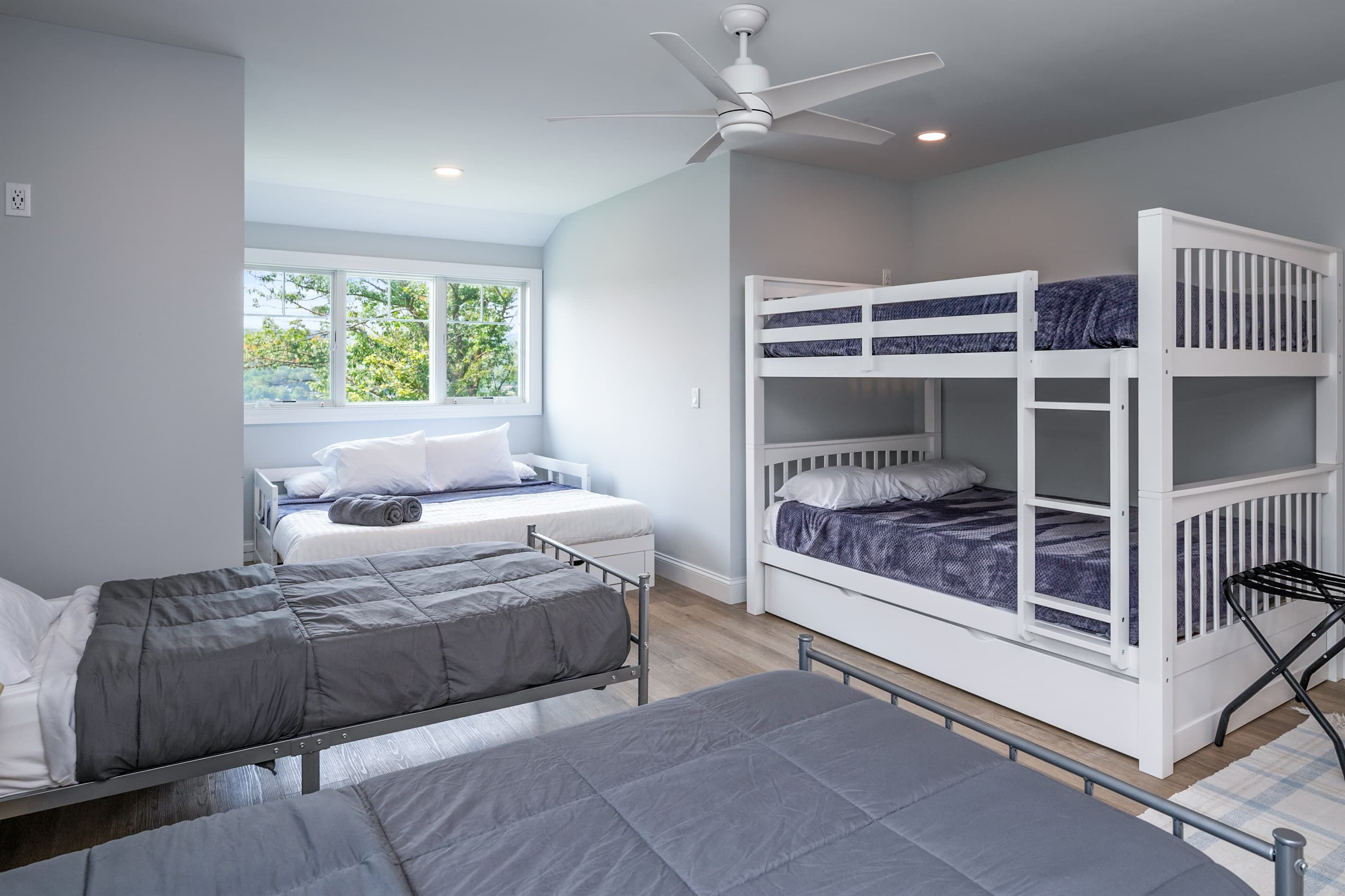 Bedroom with stacked bunks and separate bed