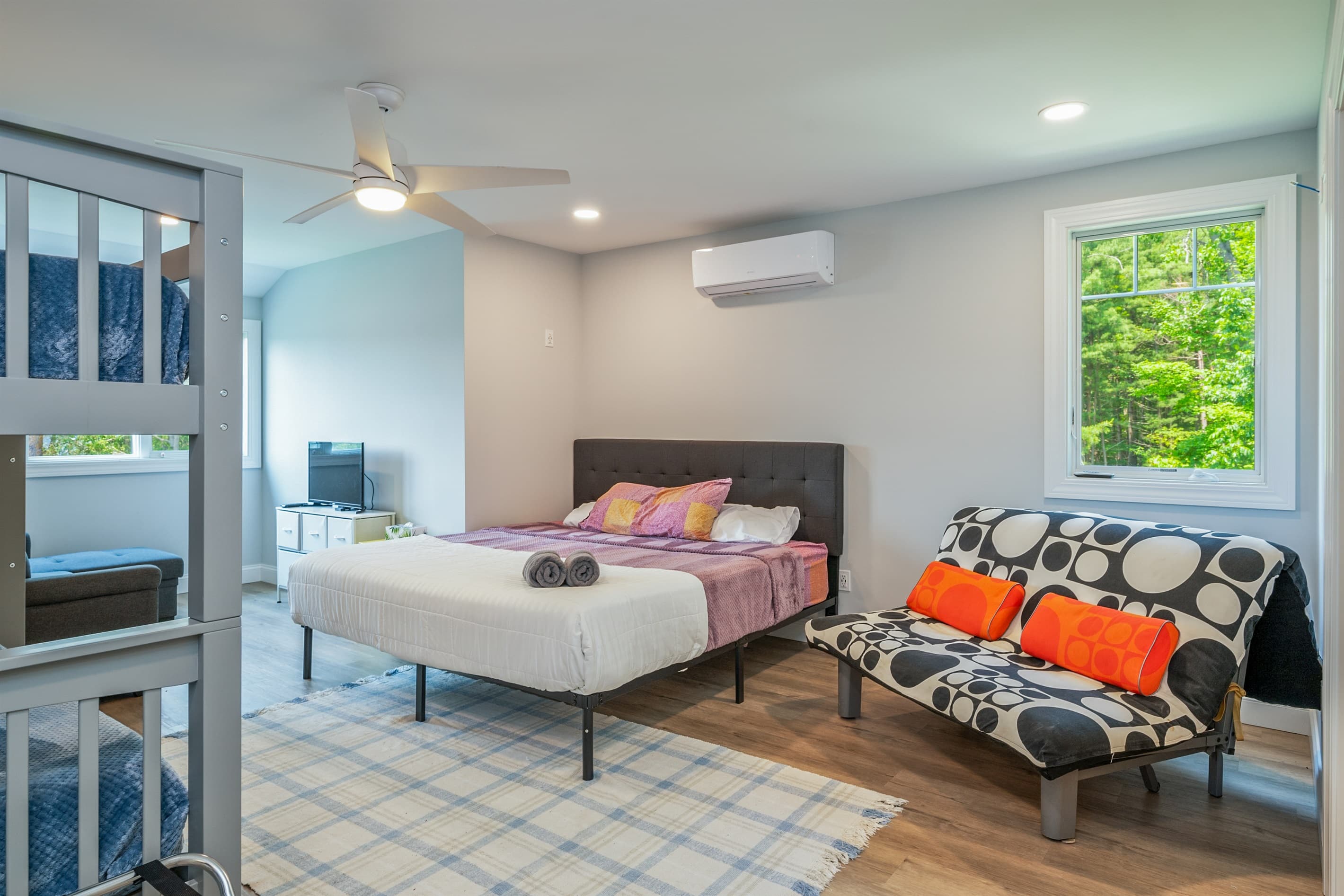 Bedroom with bed and stacked bunks