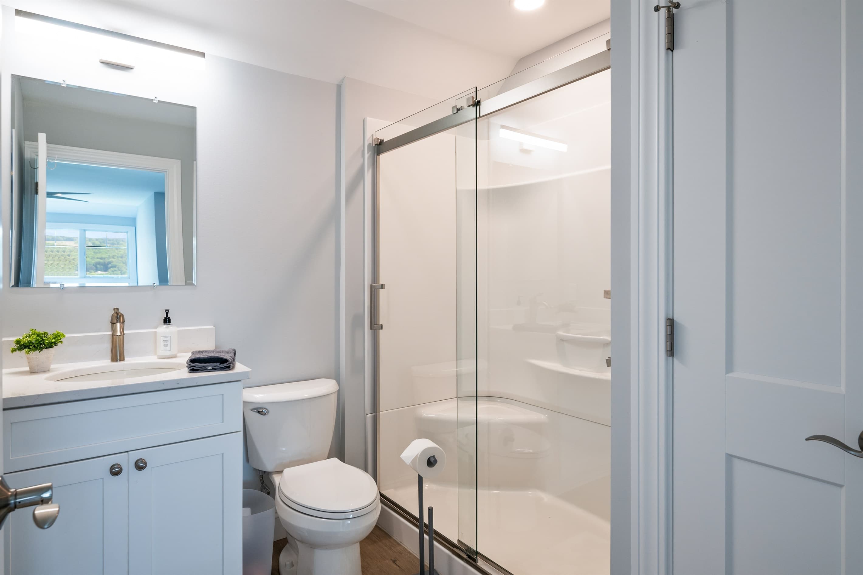 Ensuite bathroom with glass-enclosed shower