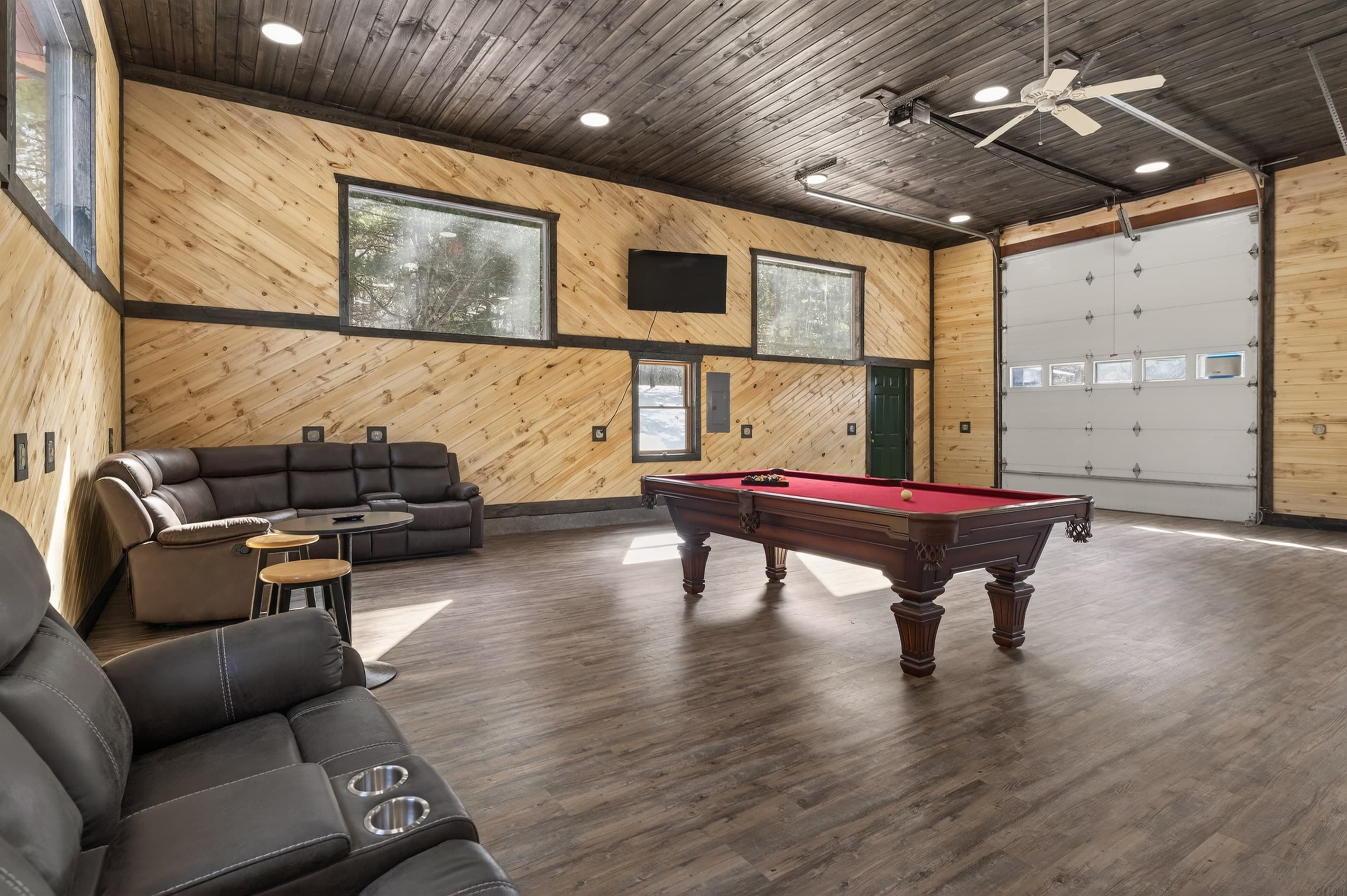 Game room with pool table and sectional