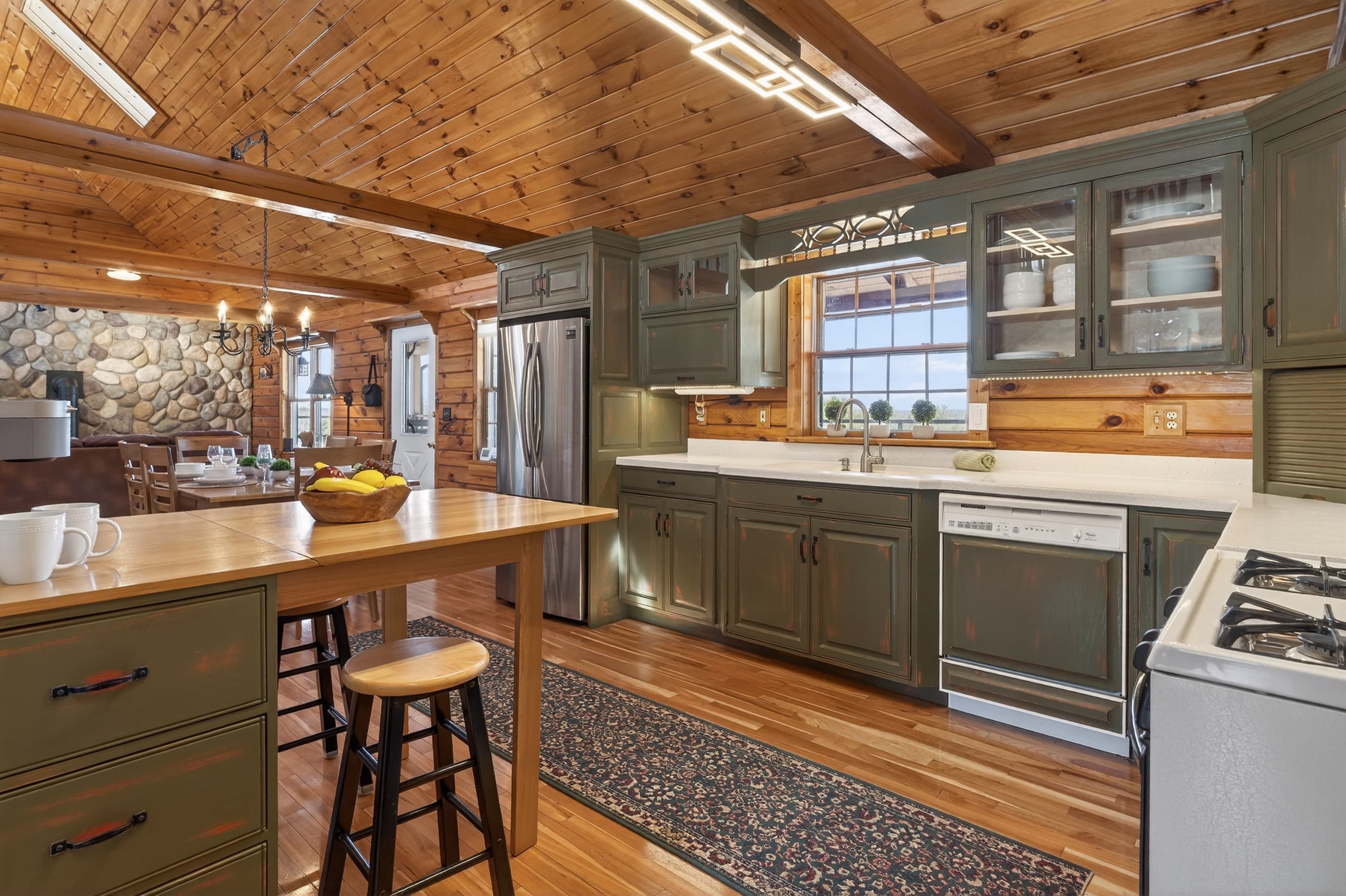 Open kitchen with dining area beyond