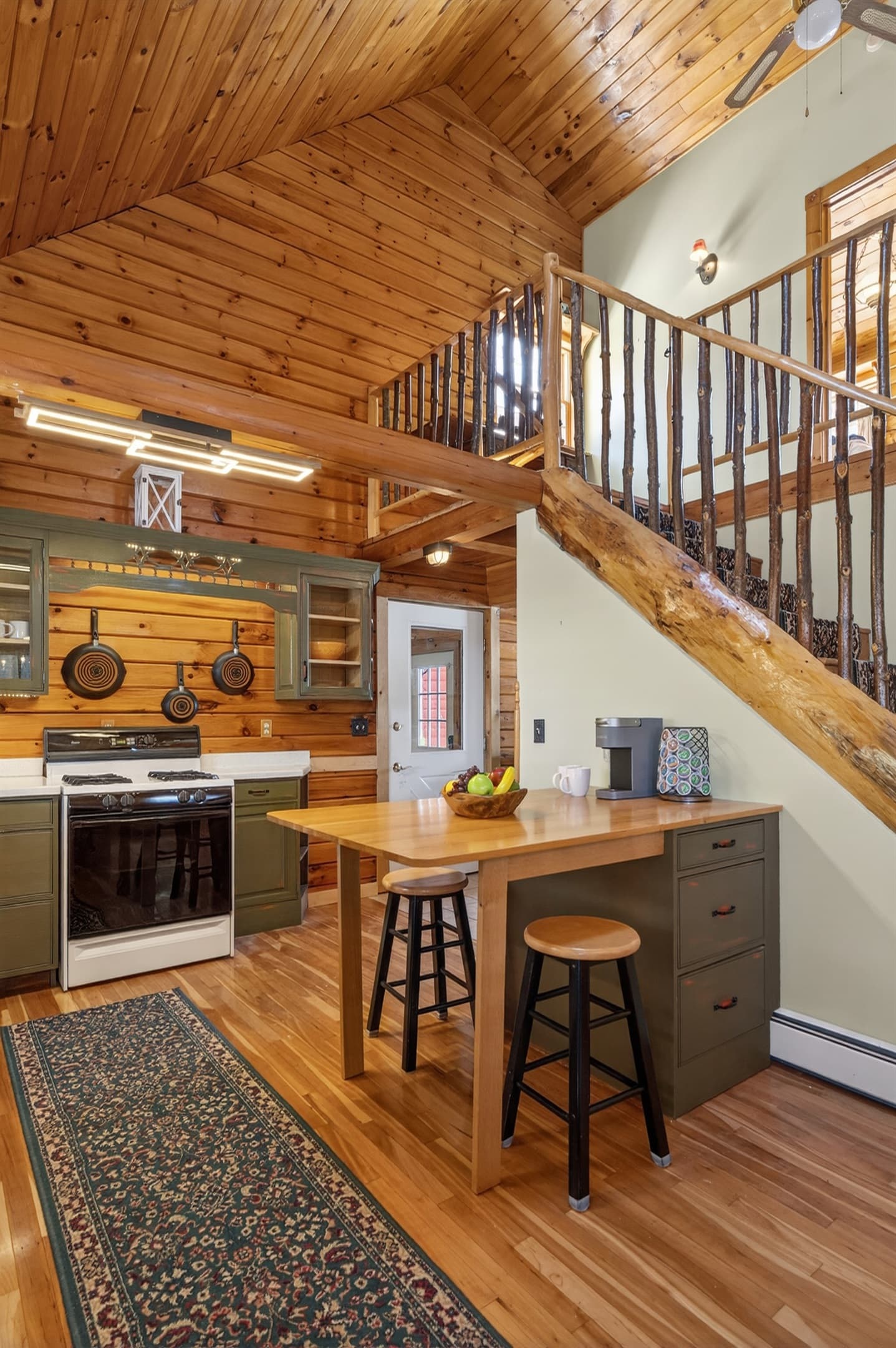 Kitchen workspace with island and refrigerator