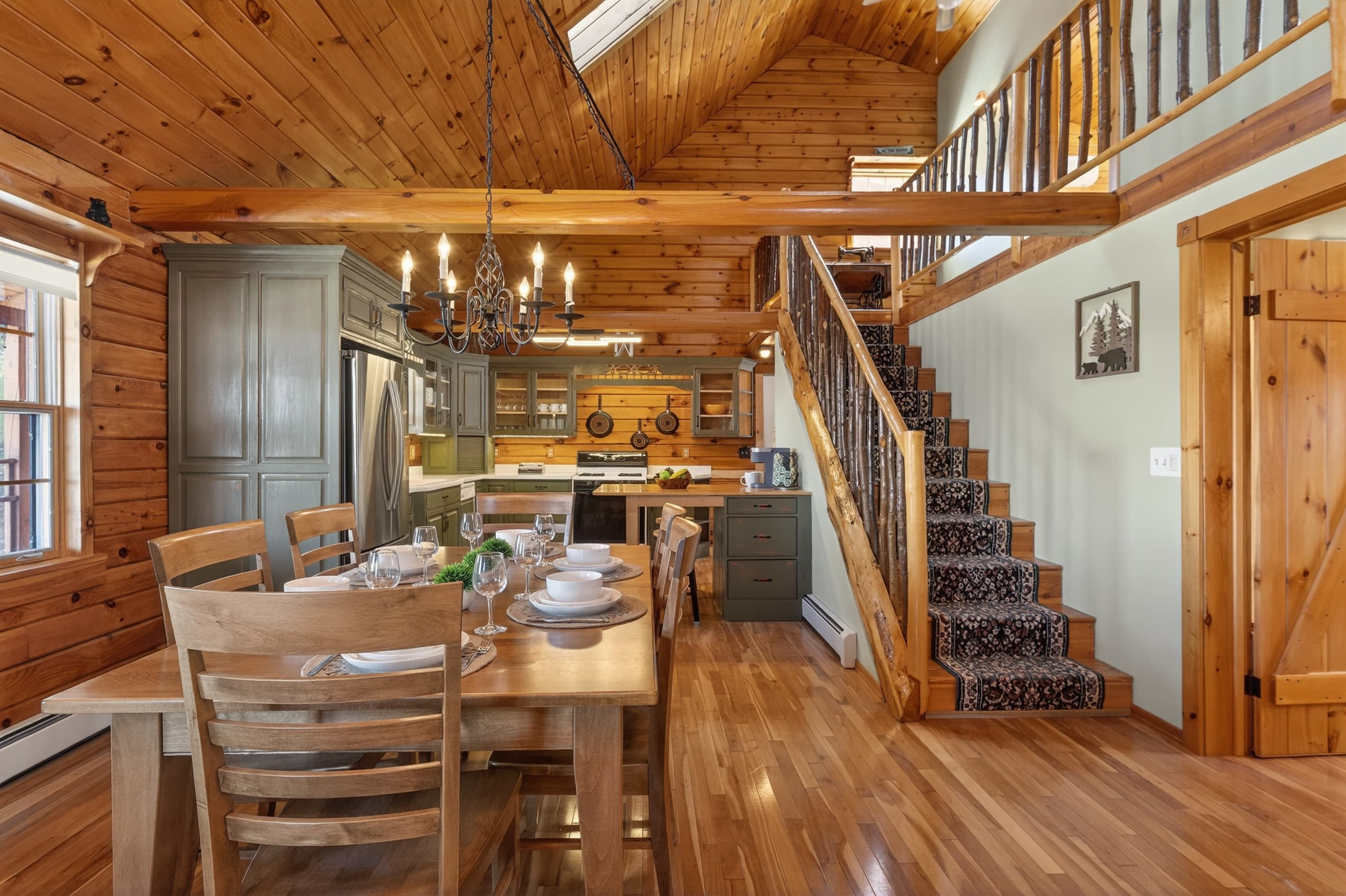 Dining table beside the wooden staircase