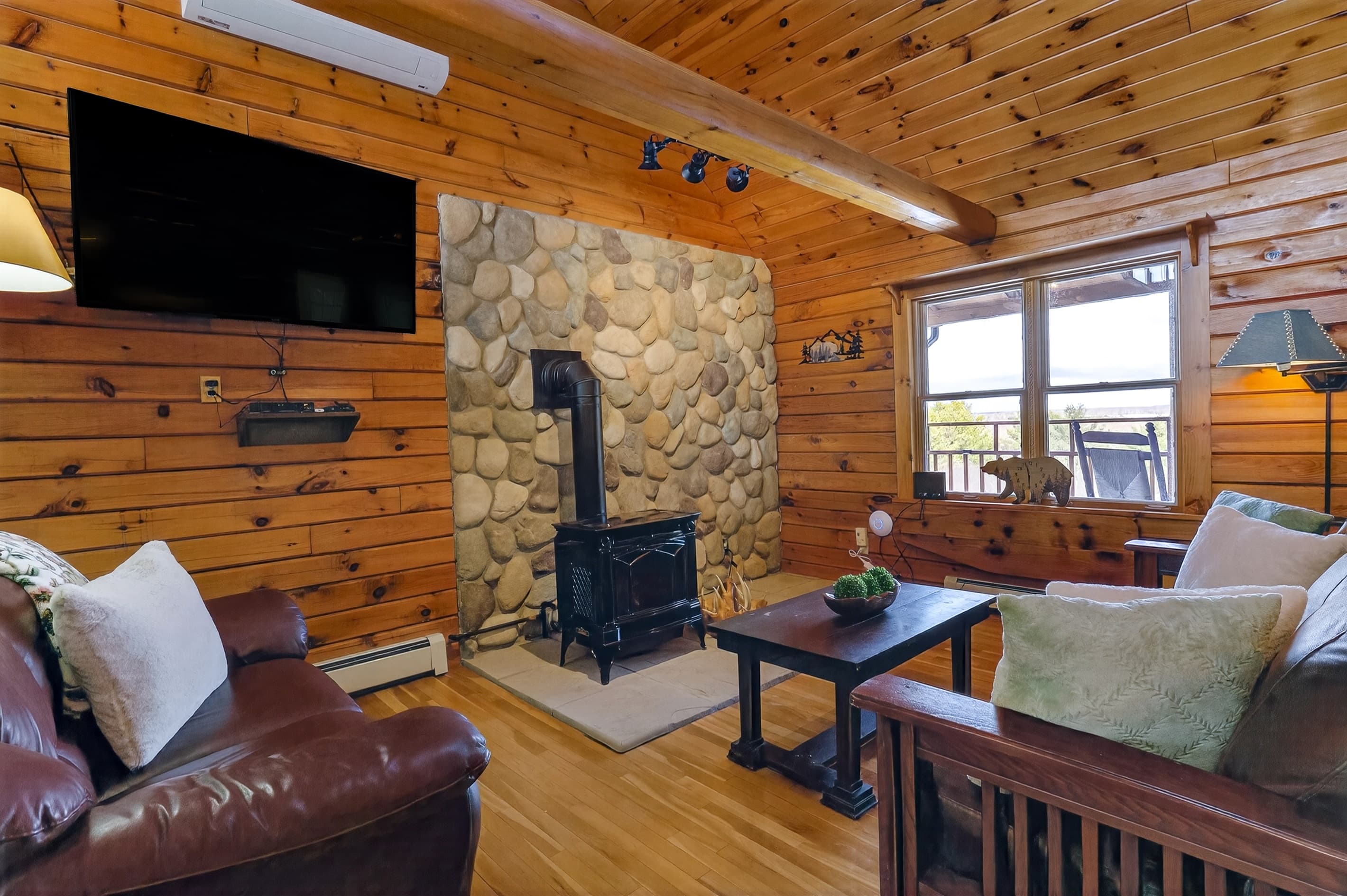 Wood stove against the stone accent wall