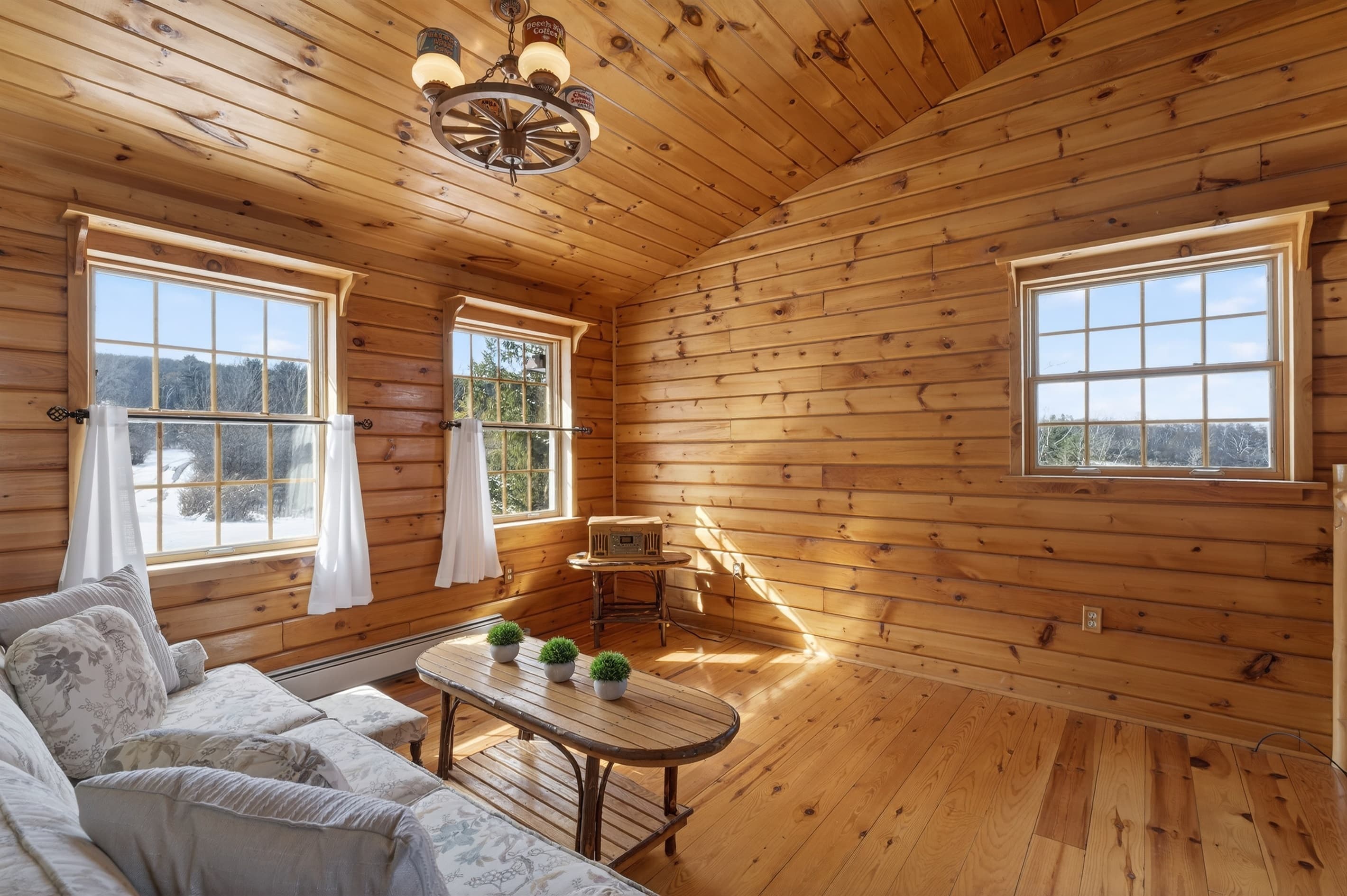 Wood-paneled lounge with multiple windows