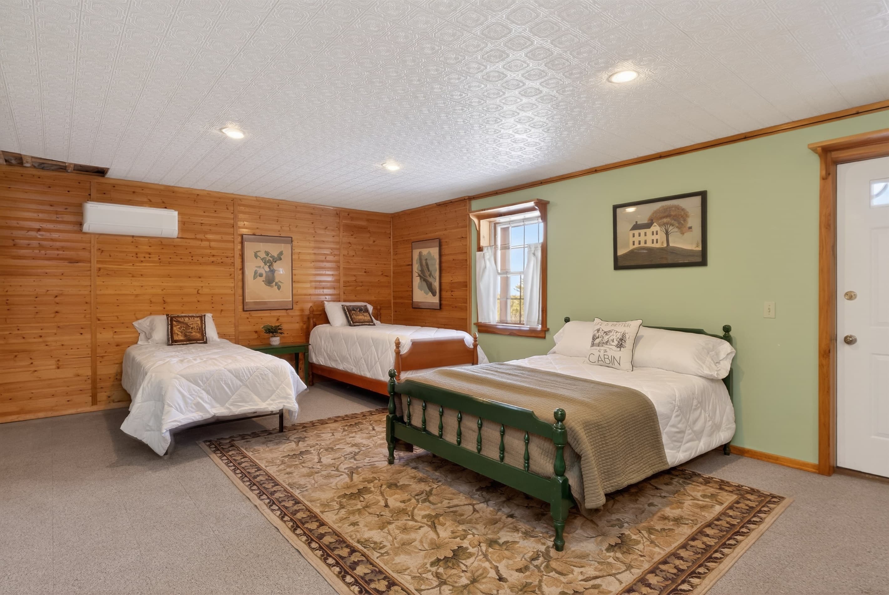 Lower level bedroom # 4 with two twins, a double bed and a queen futon 