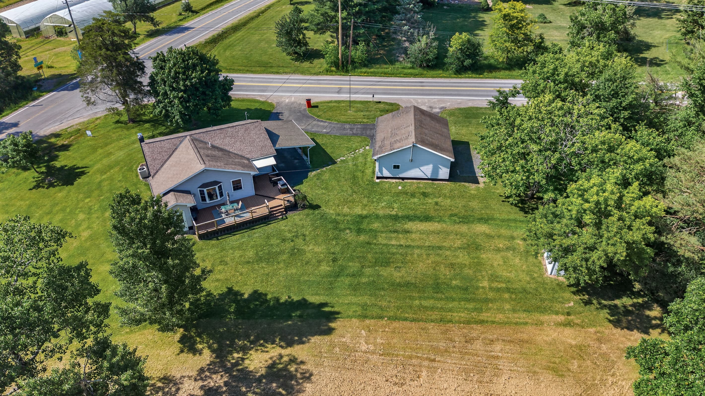 Aerial view of the home and outbuilding