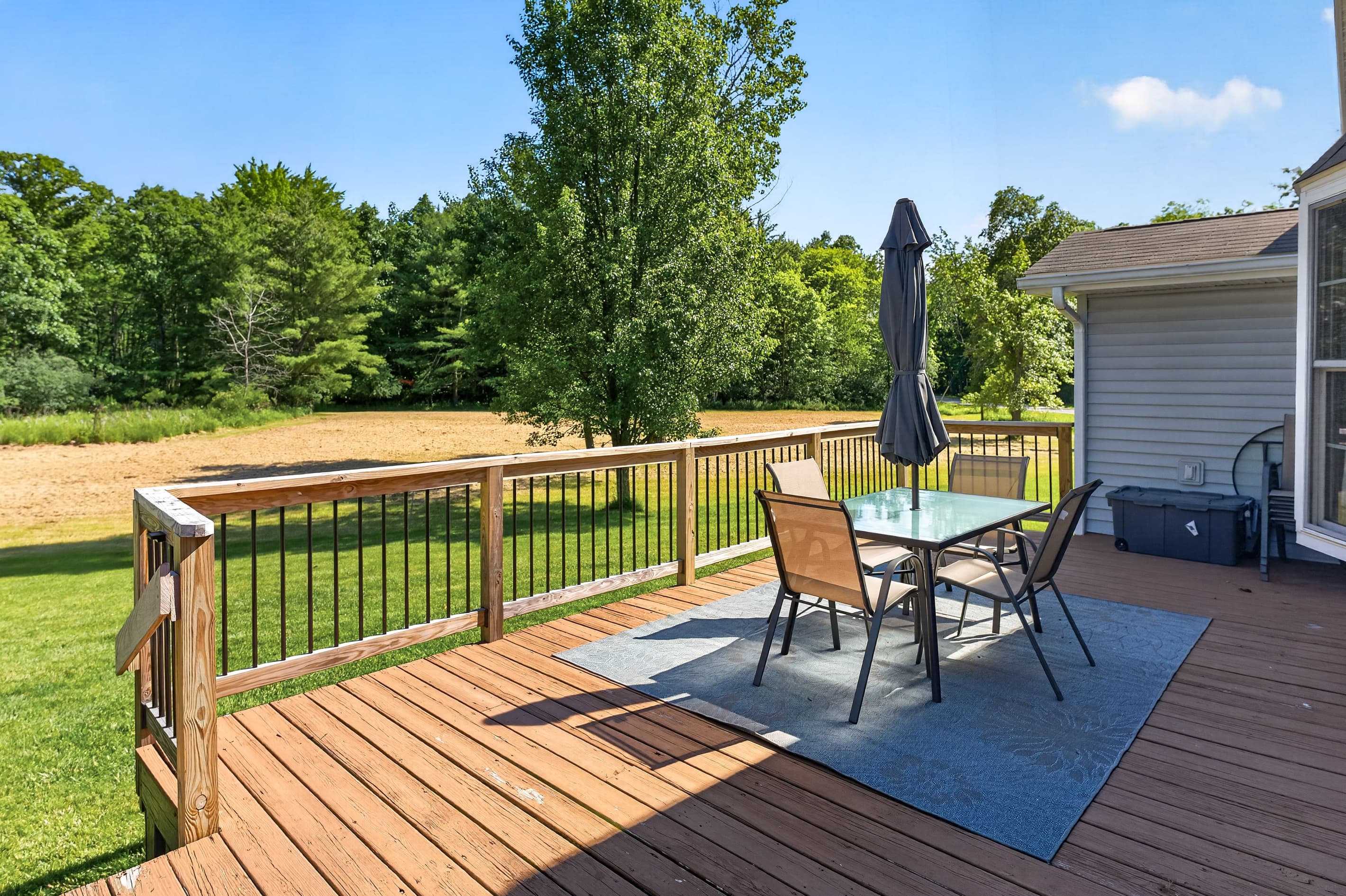 Deck table with chairs and umbrella