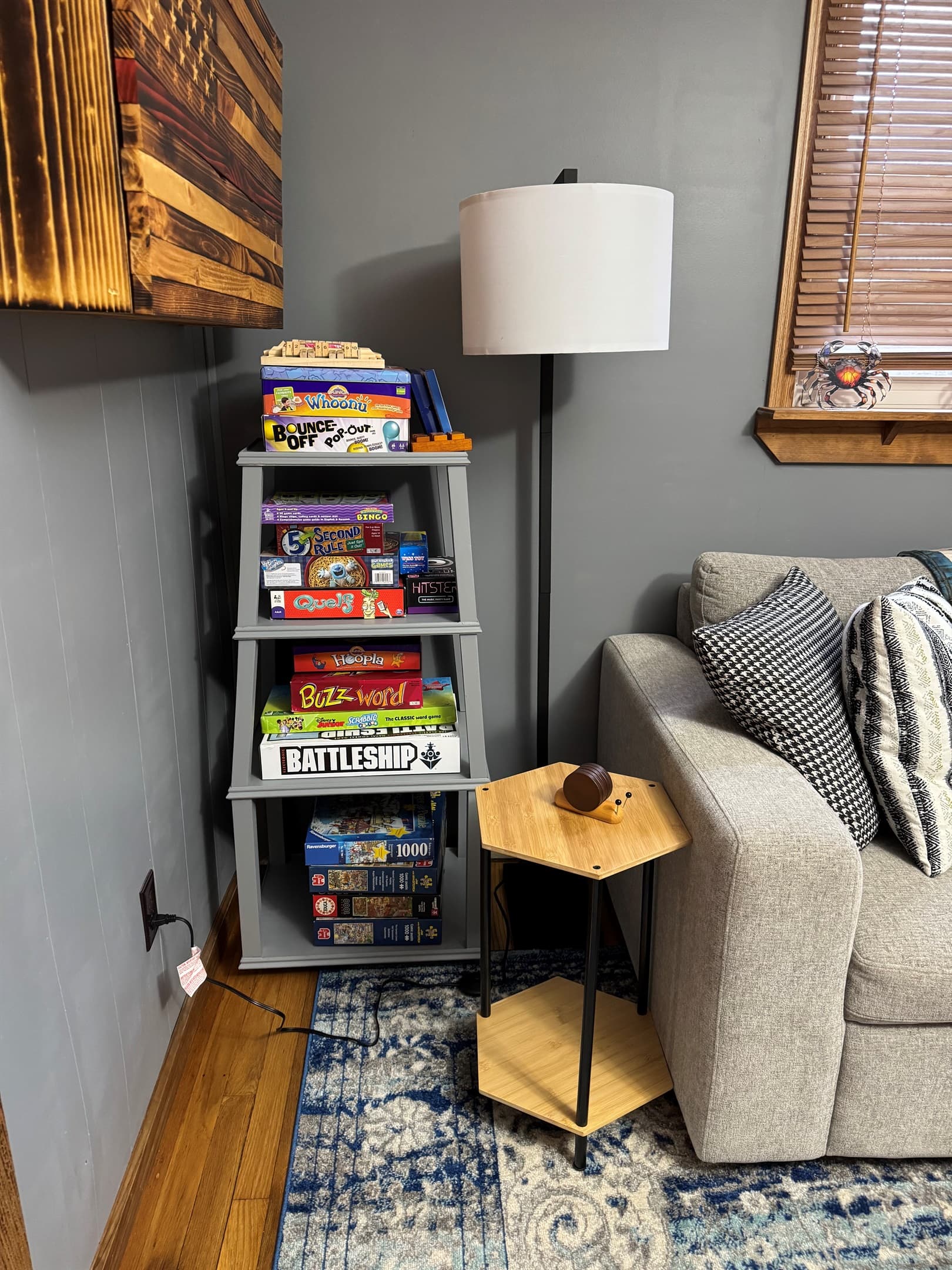 Board game collection beside the sofa