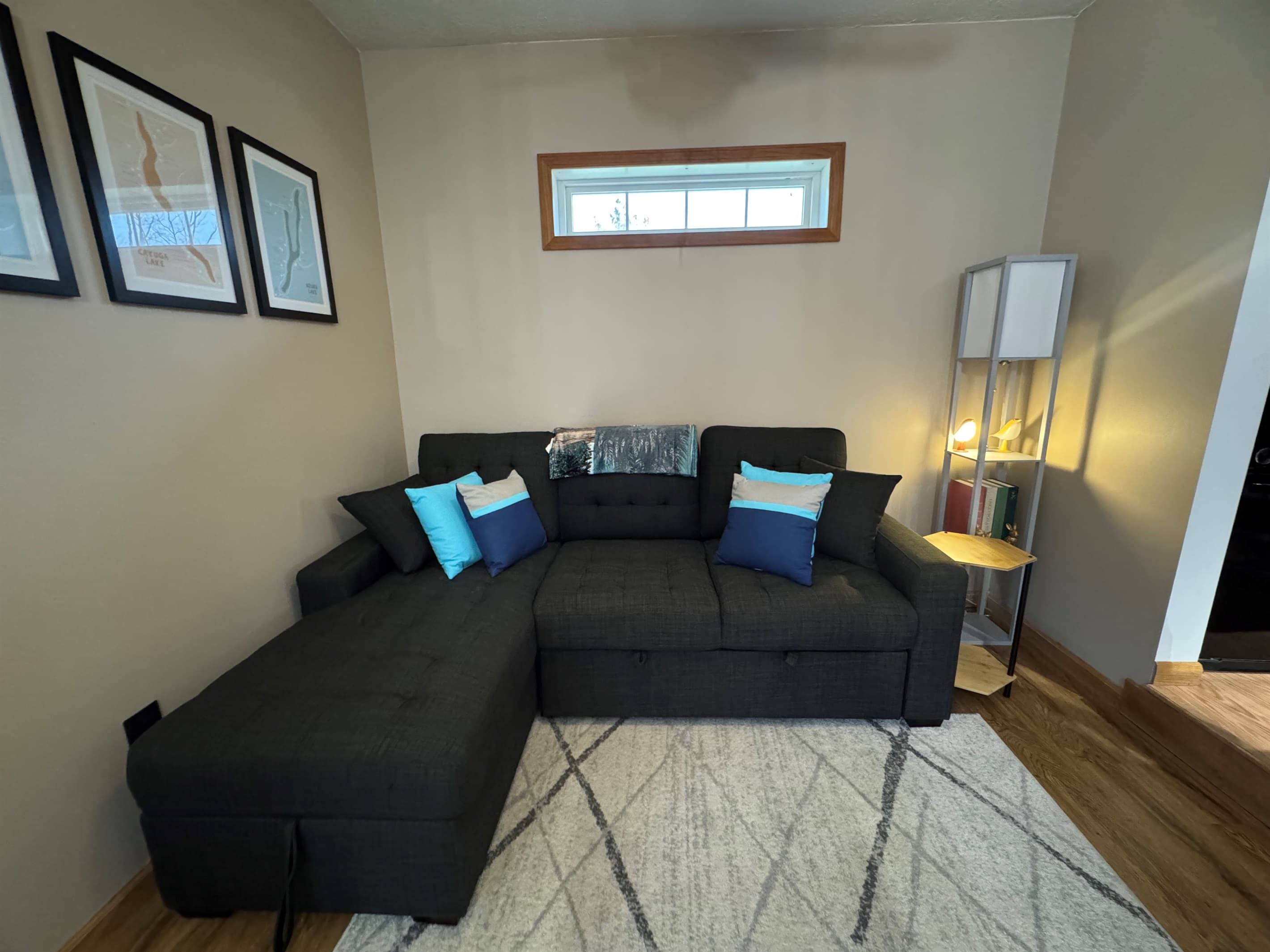 Sitting area with black sectional sofa