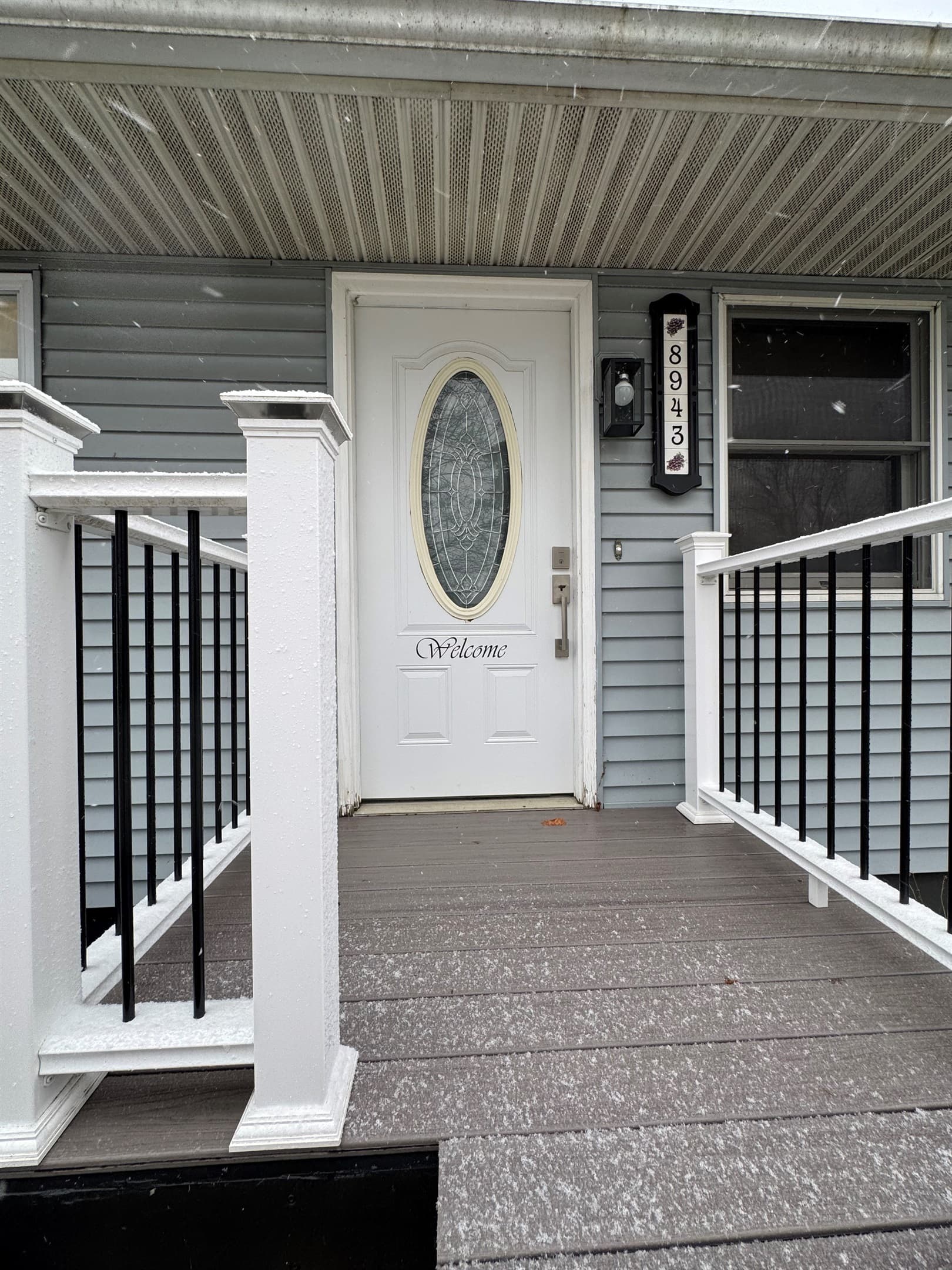 Covered entry ramp with black railings