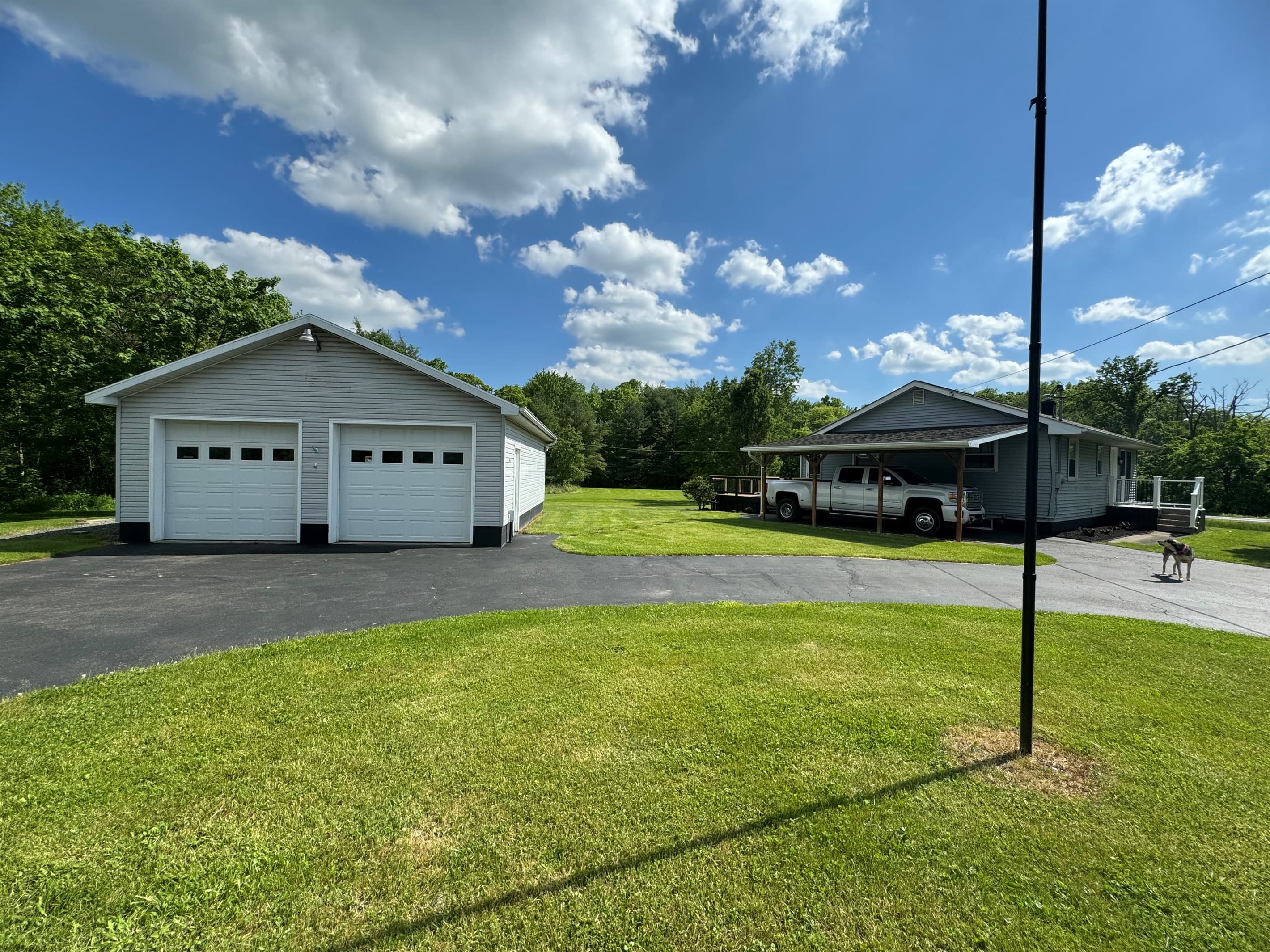 Garage viewed across the lawn