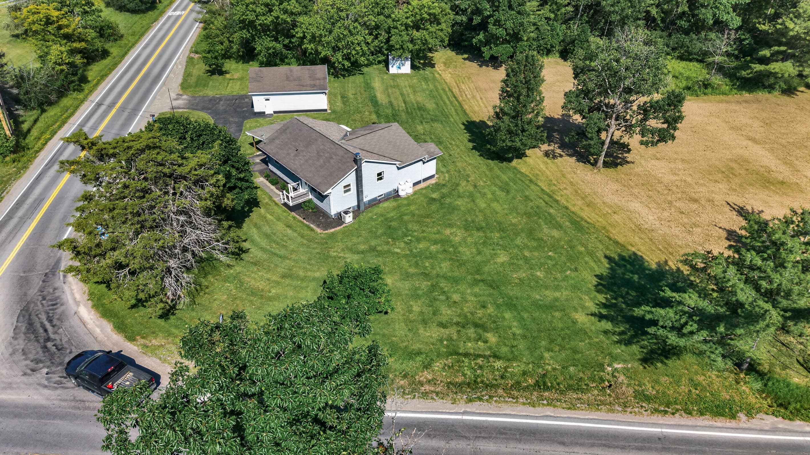 Aerial view of the house and surrounding lawn