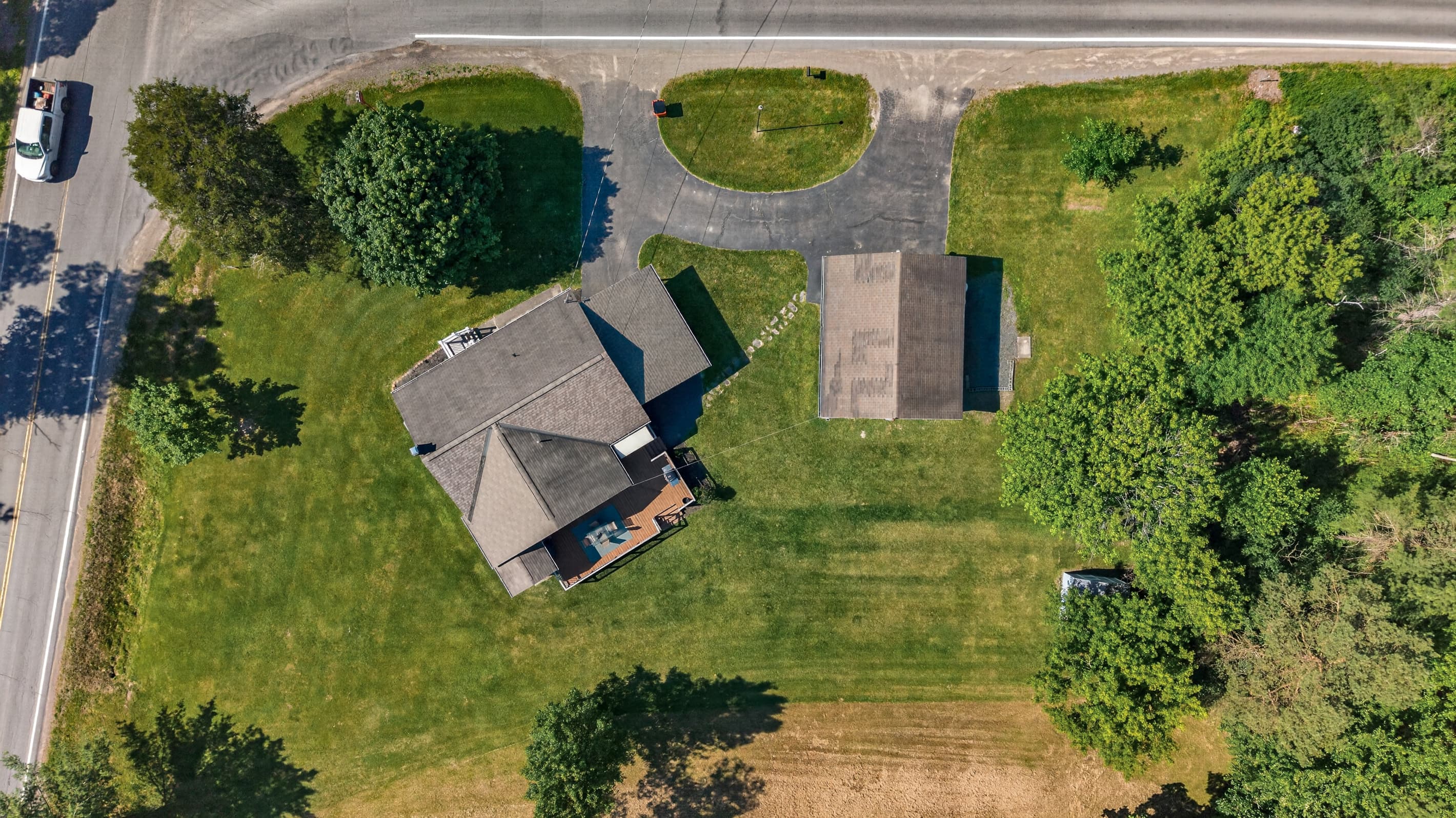 Overhead view of the home and outbuilding