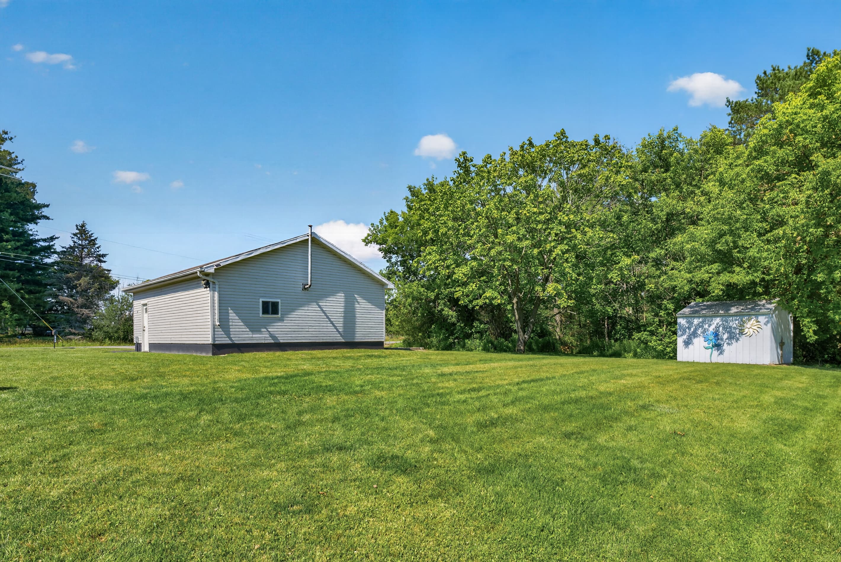 Property viewed across open lawn