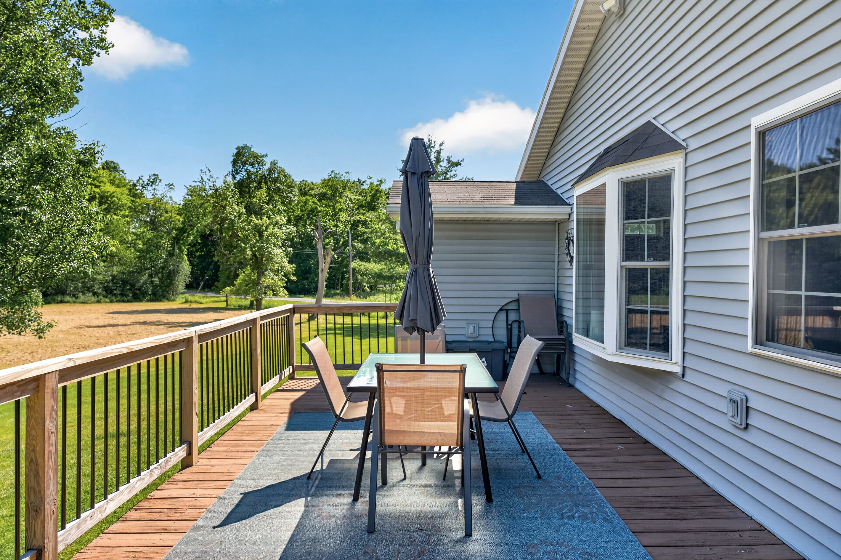 Deck dining table with umbrella