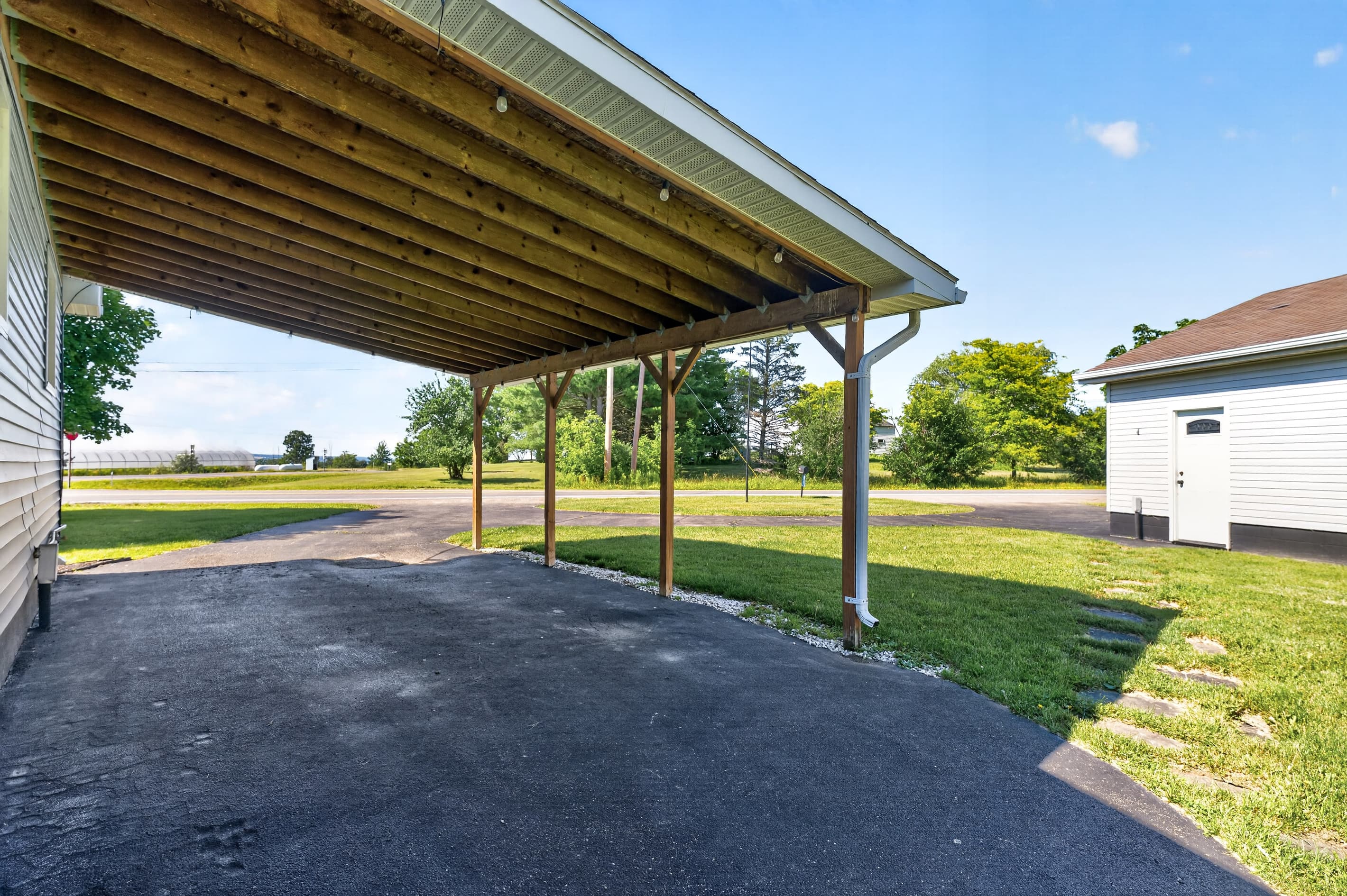 Covered parking area beside the home