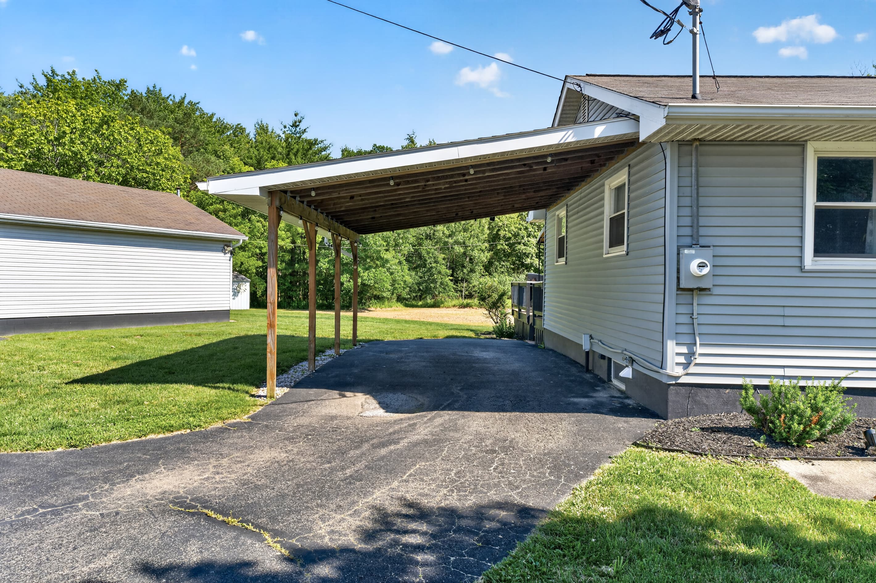 Driveway running beside the covered carport