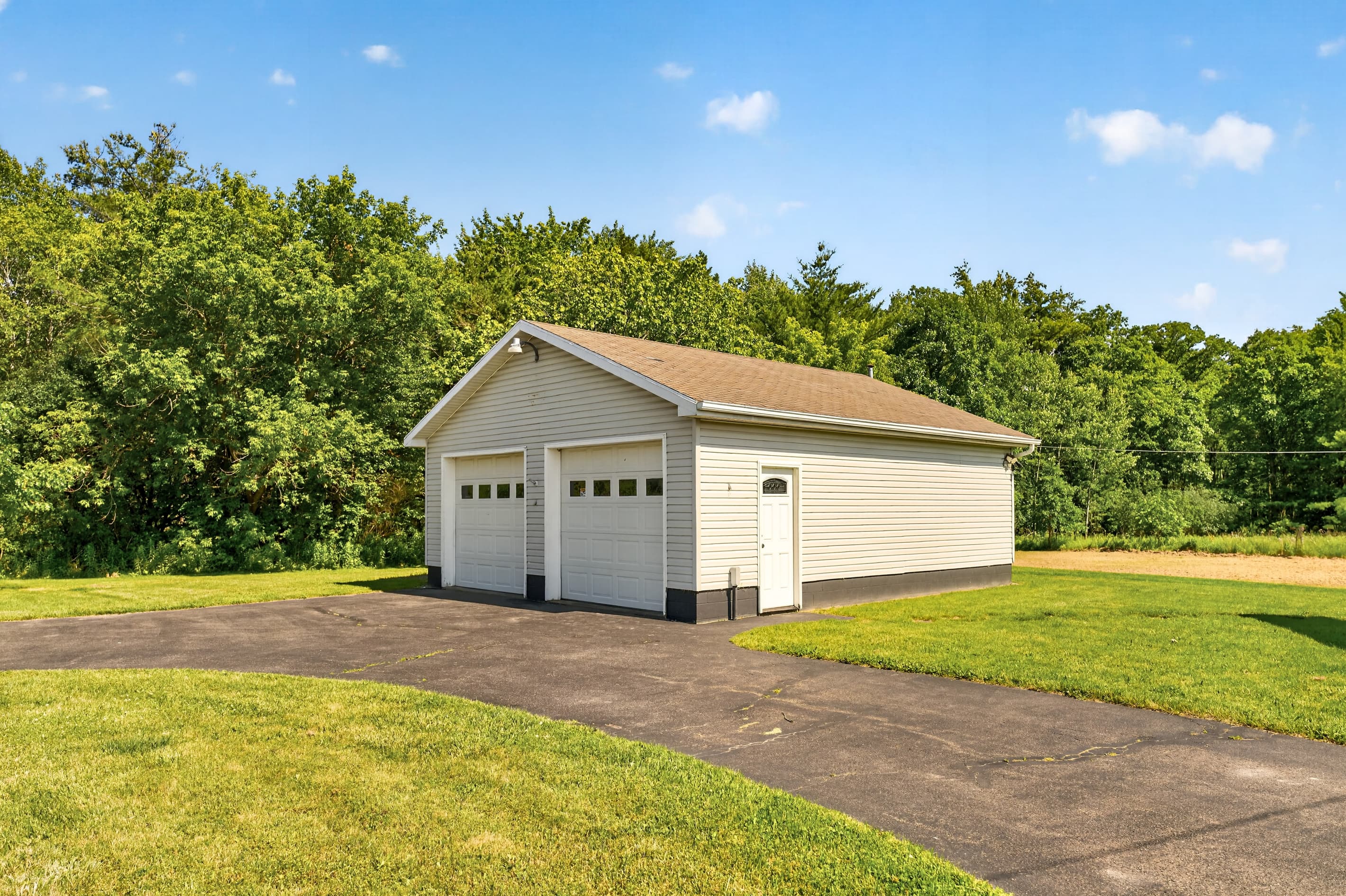 Detached garage viewed from the driveway
