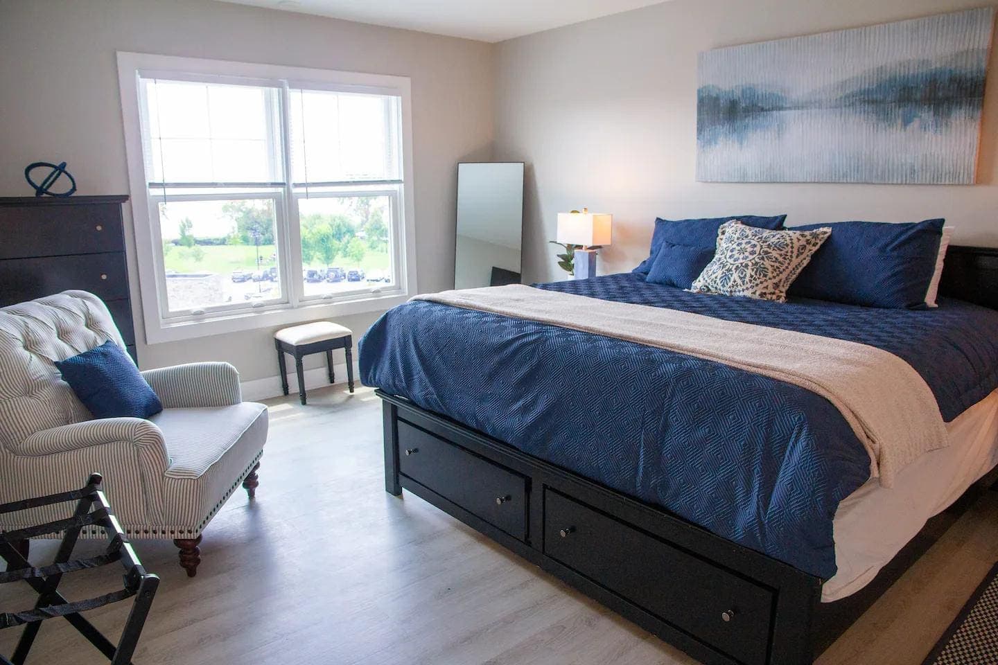 Bedroom with blue bedding and wide windows