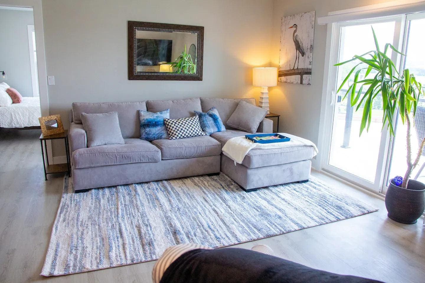 Sitting area with floor-to-ceiling glass doors to the balcony