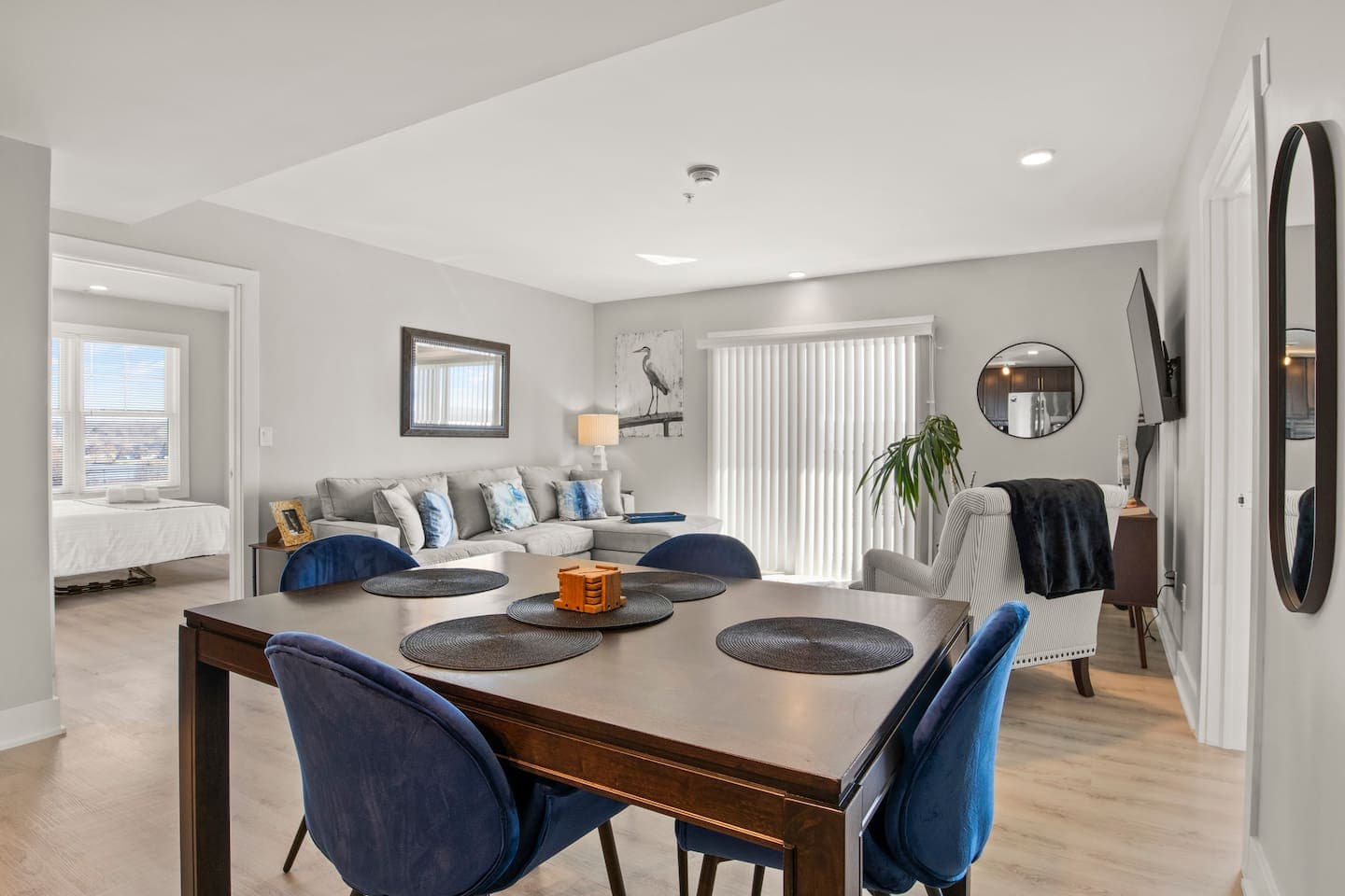 Dining table with blue upholstered chairs
