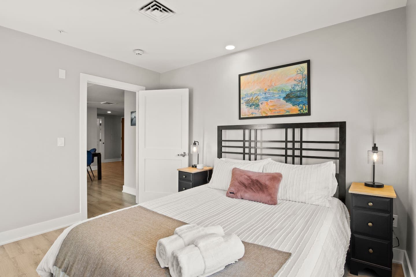 Bed framed by matching nightstands