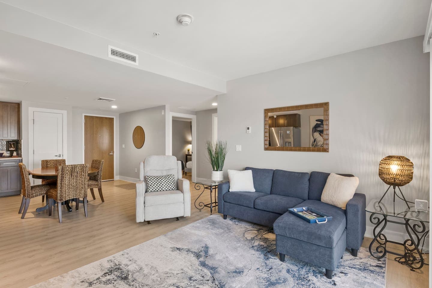 Living room with blue sofa and accent chairs