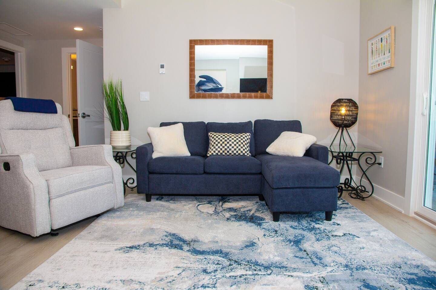Sitting area with sectional and glass end tables