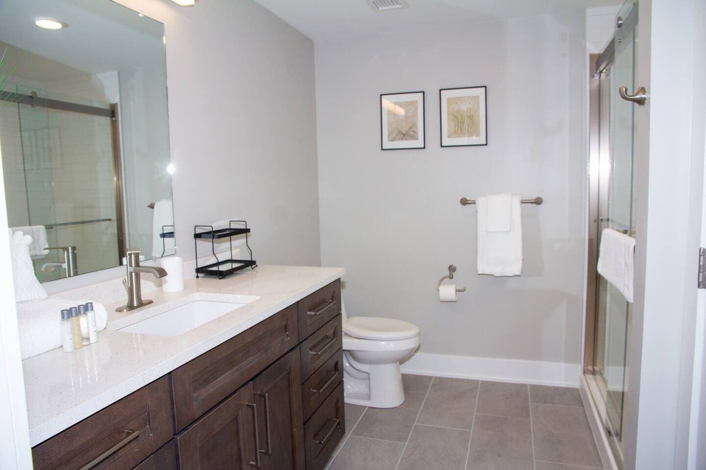 Bathroom with glass shower and double vanity