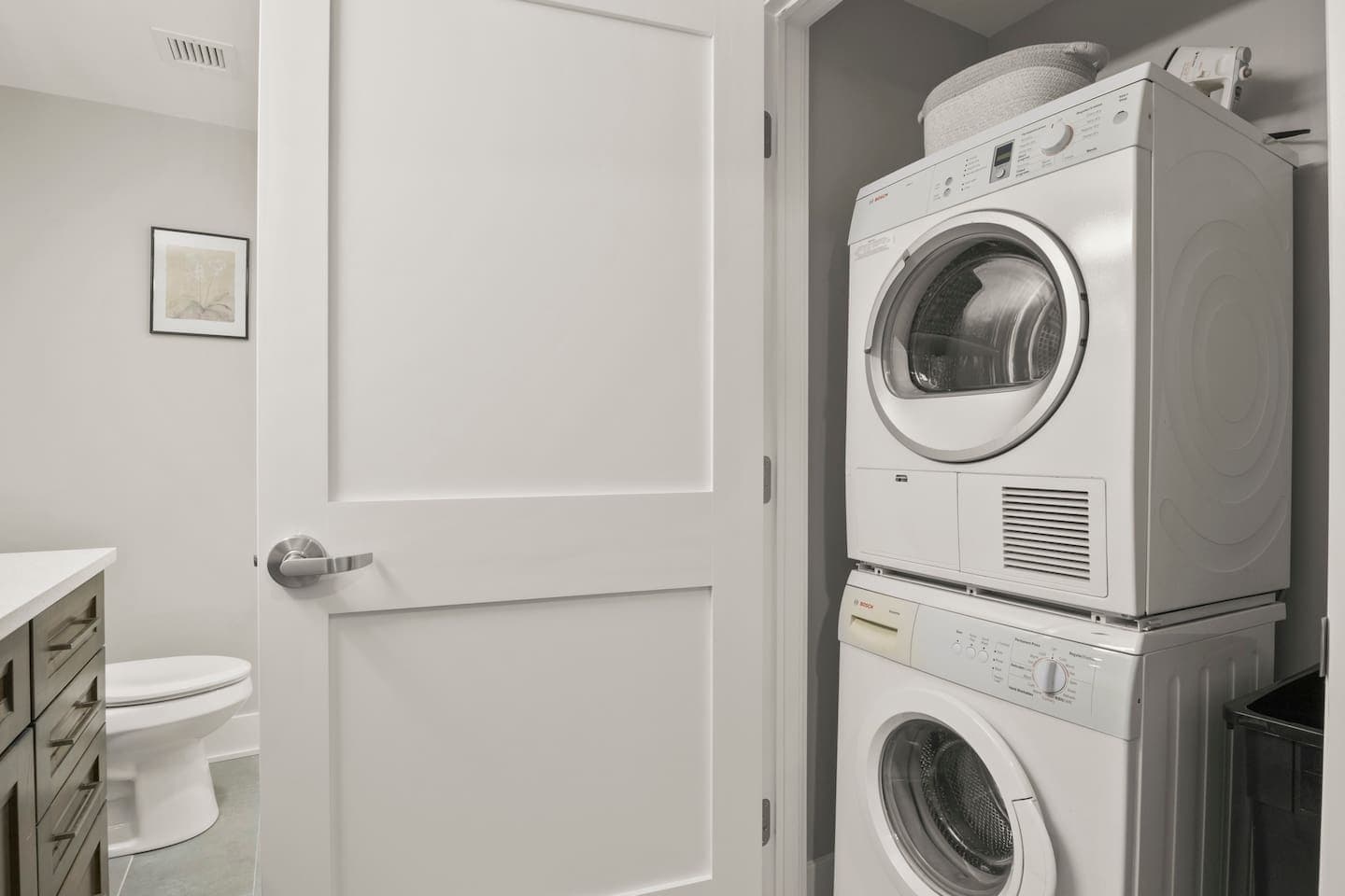 Stacked washer and dryer in laundry closet