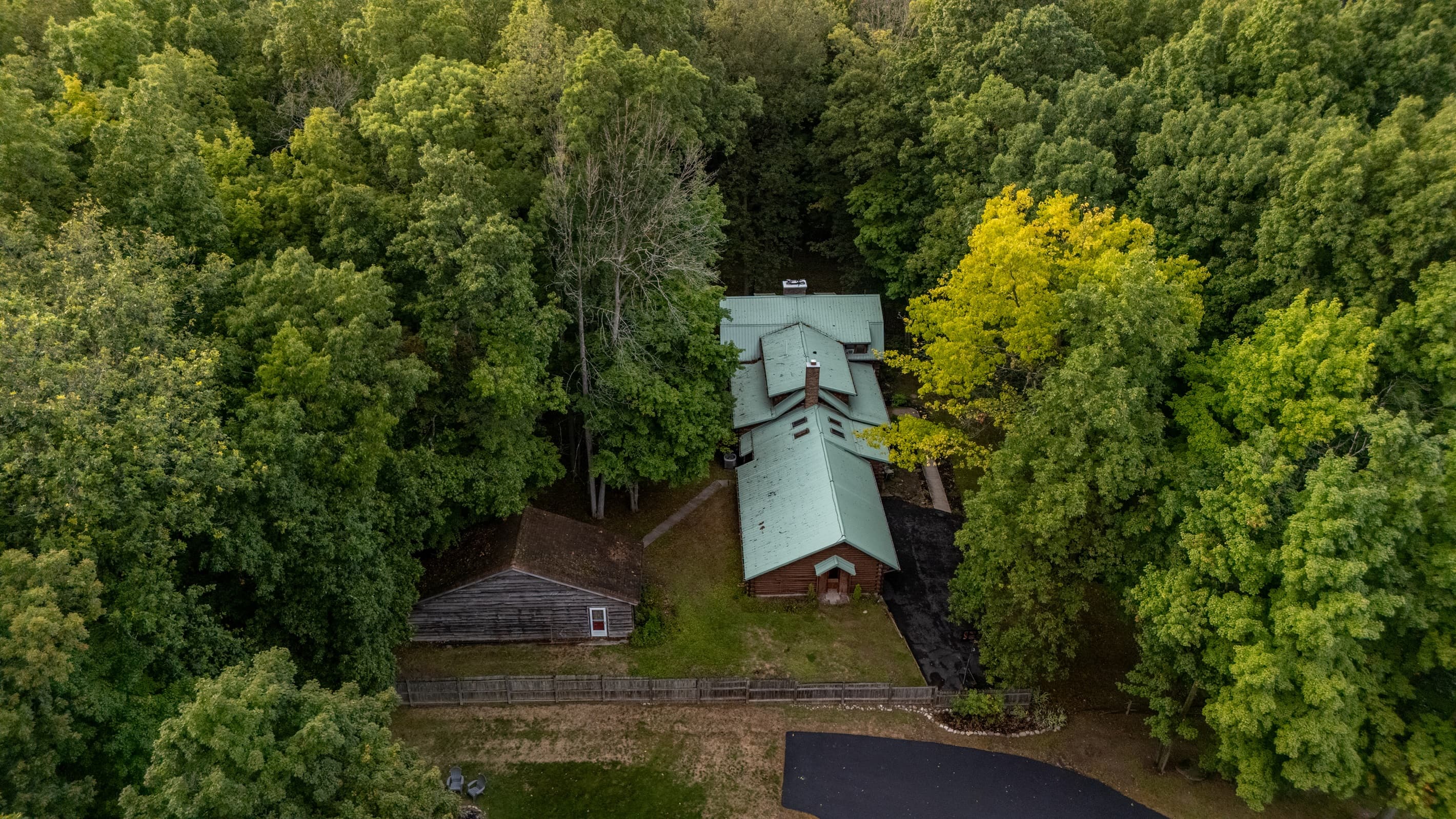 Private cabin surrounded by dense forest