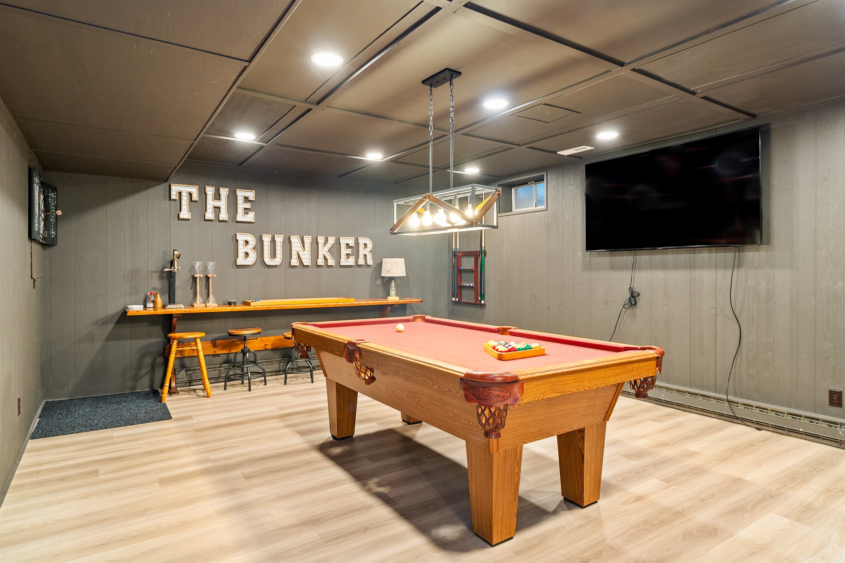Game room with pool table and television