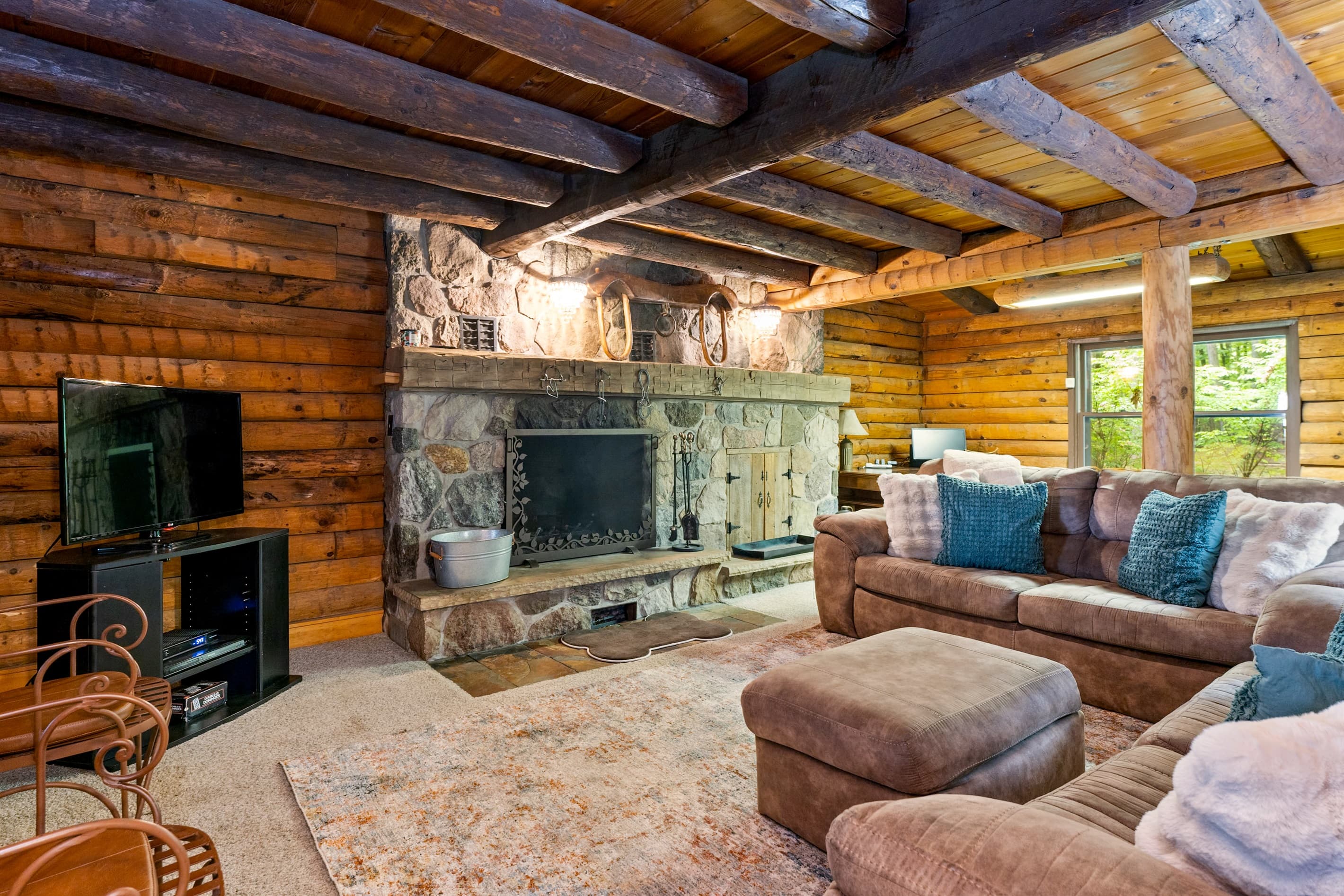Stone fireplace anchoring the main living room
