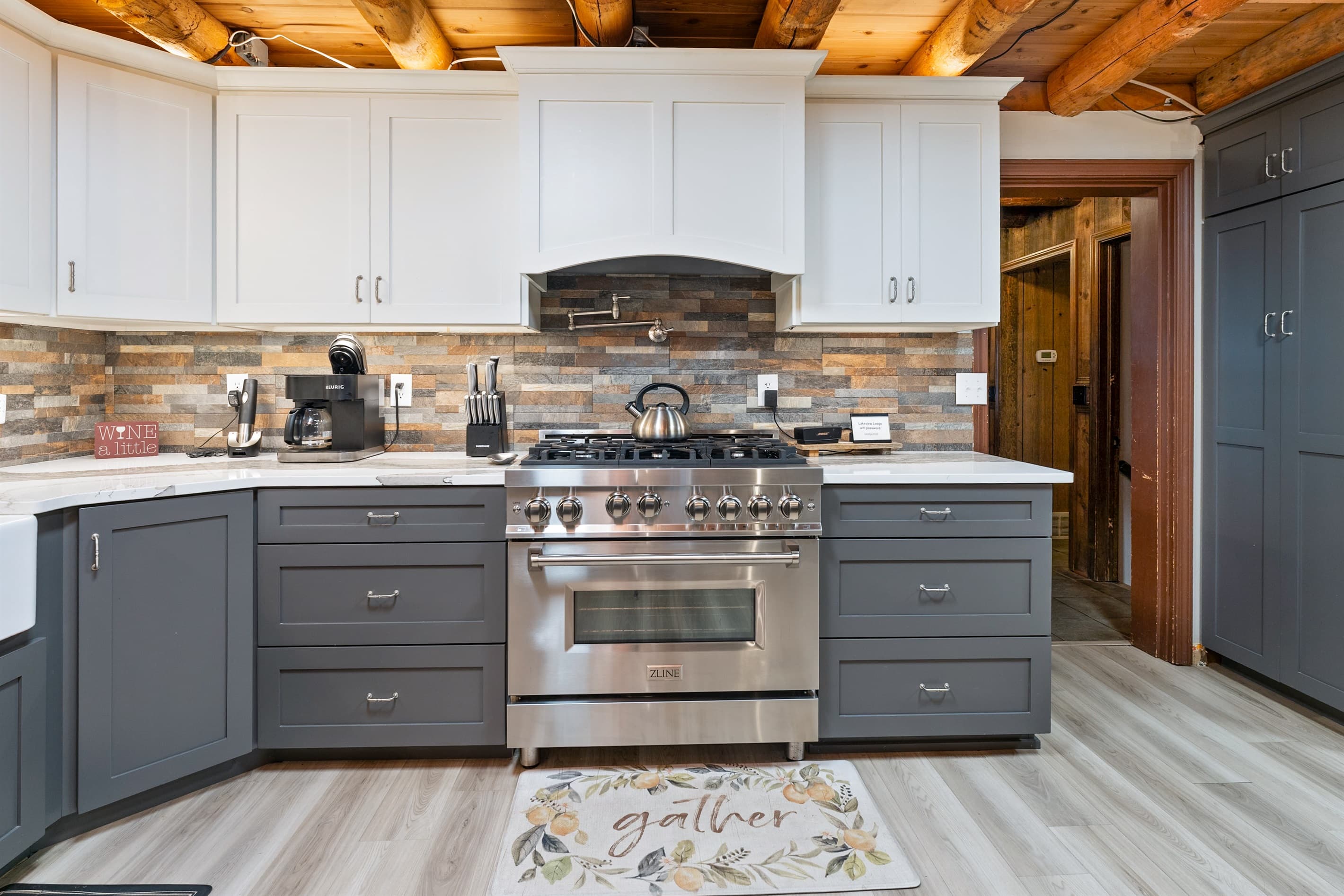 Cooking area with range and dark drawers