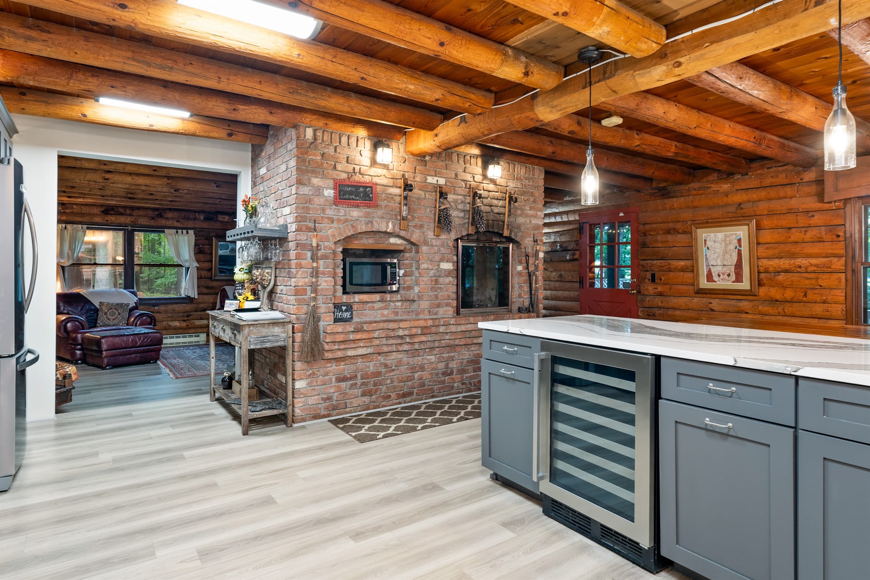 Kitchen with brick accents and gray cabinetry
