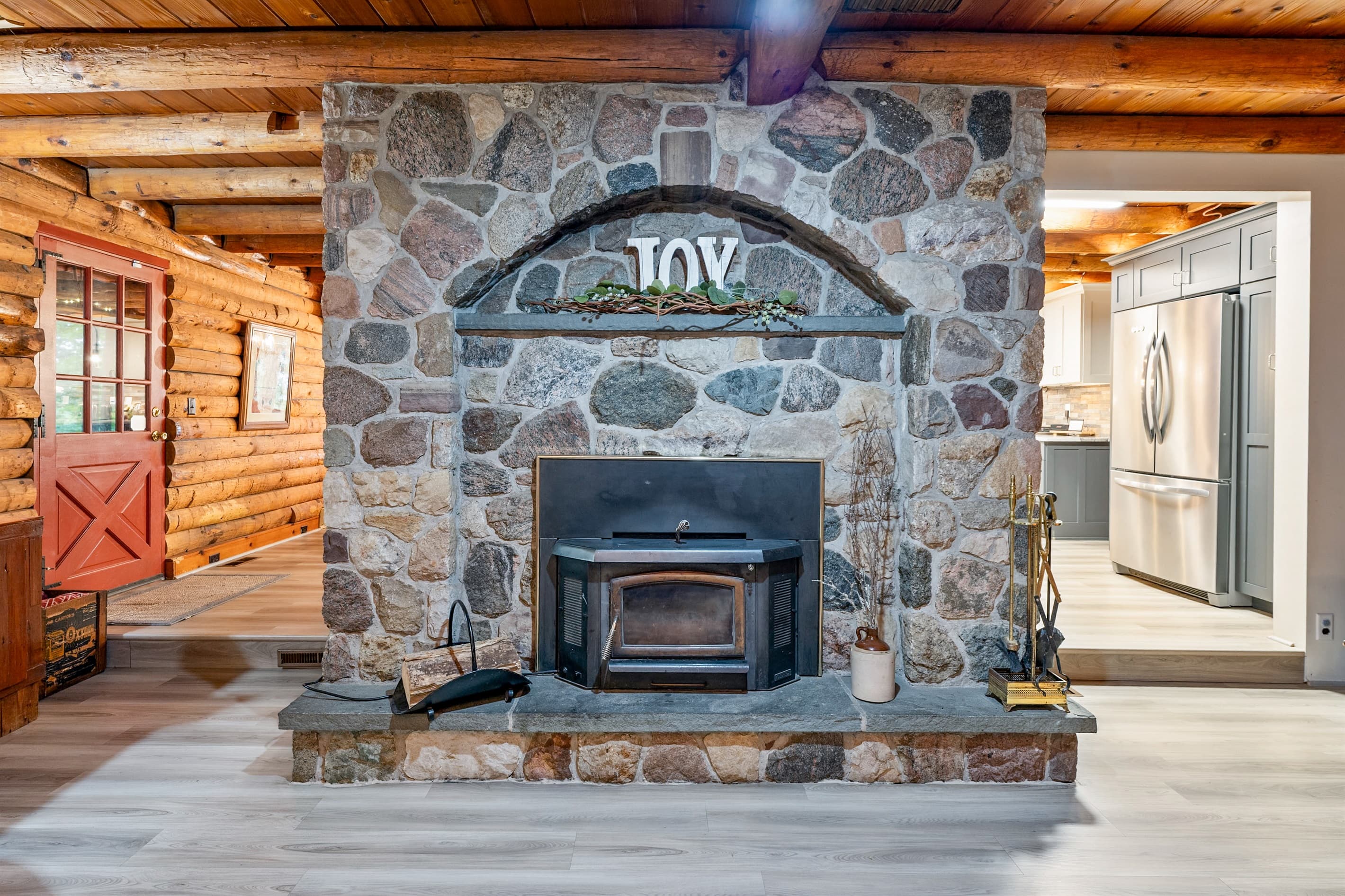 Stone fireplace in the middle of living area