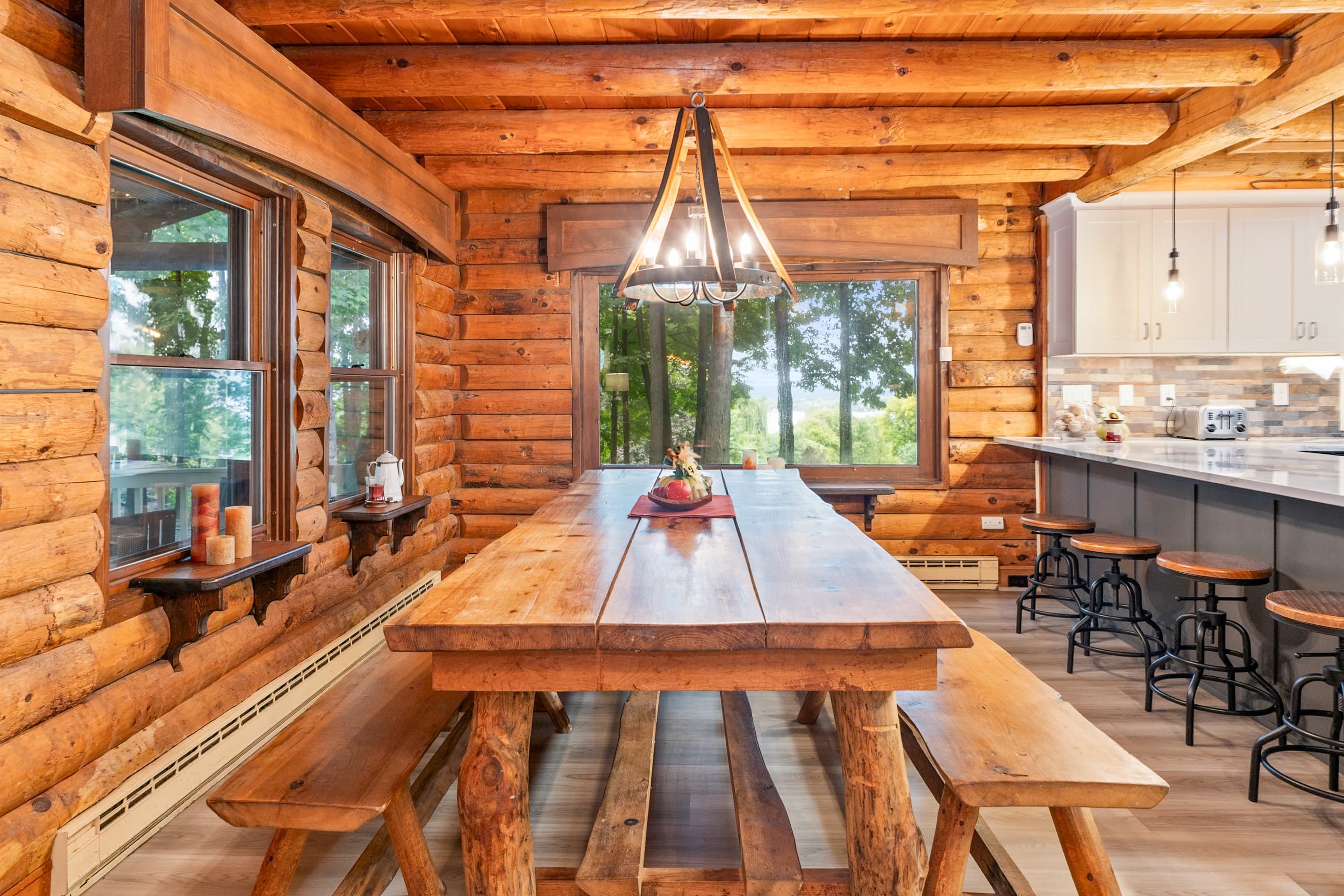 Long dining table beneath exposed beams