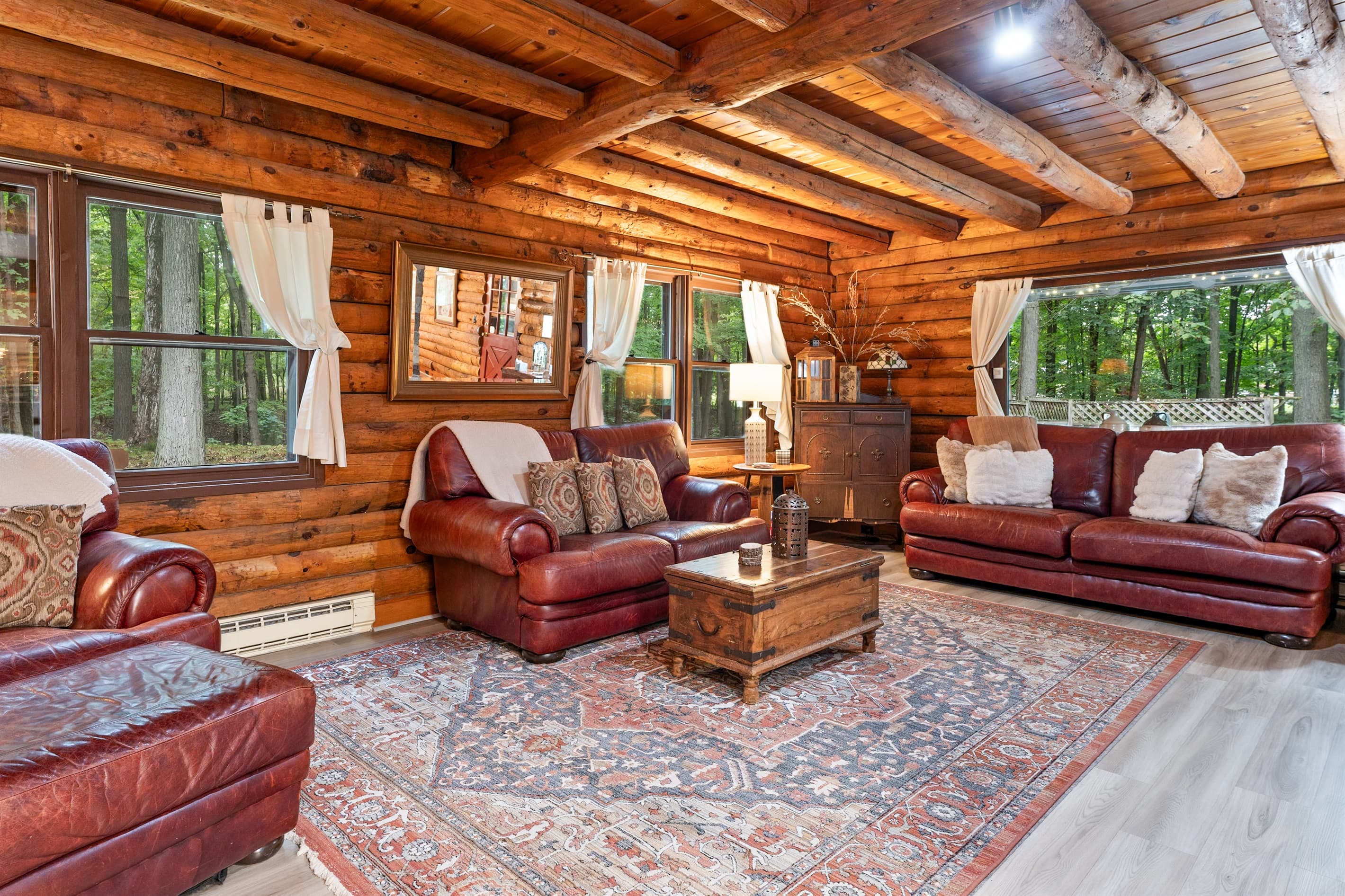 Wood-paneled lounge with red leather furniture