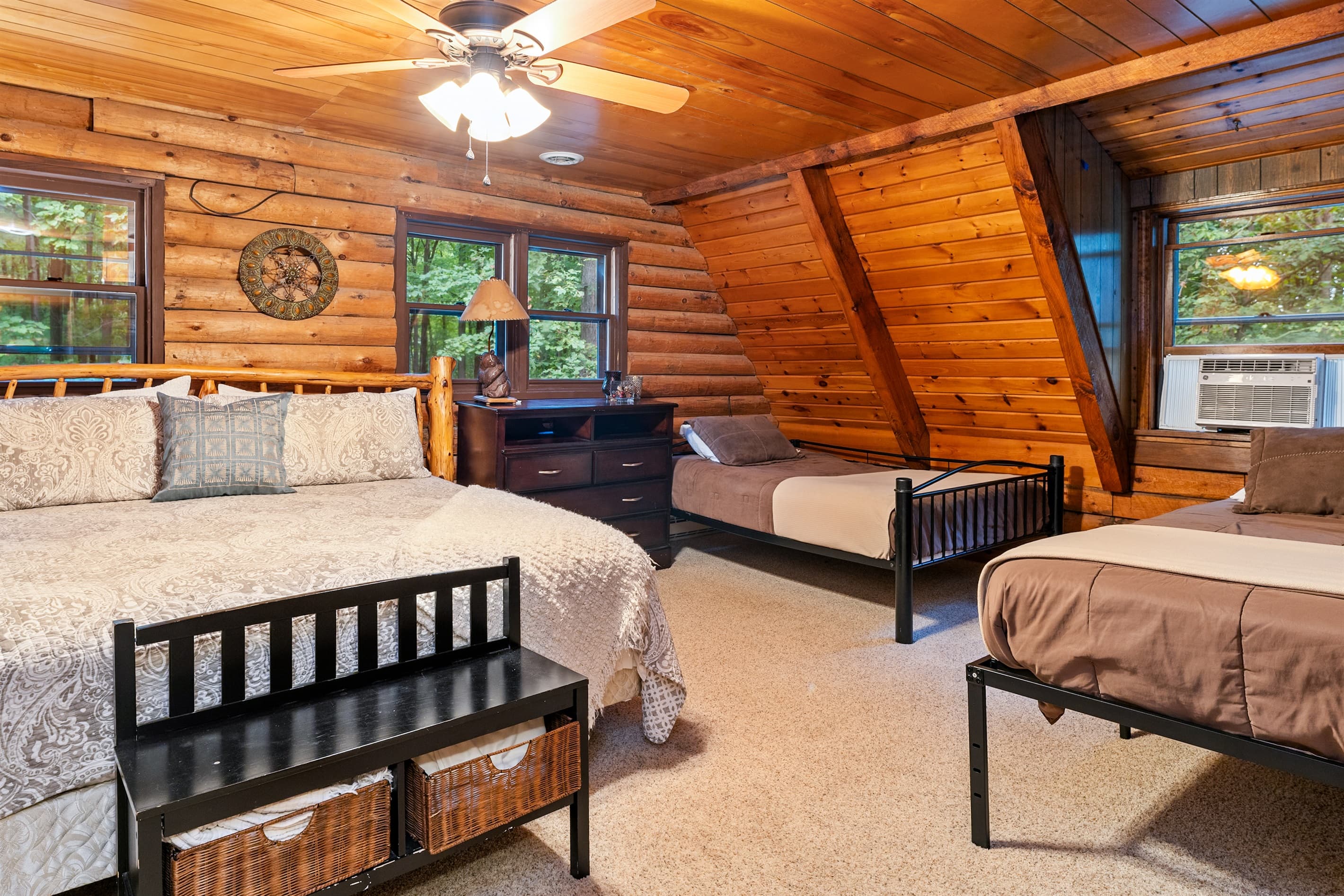 Bedroom with king bed and two double beds