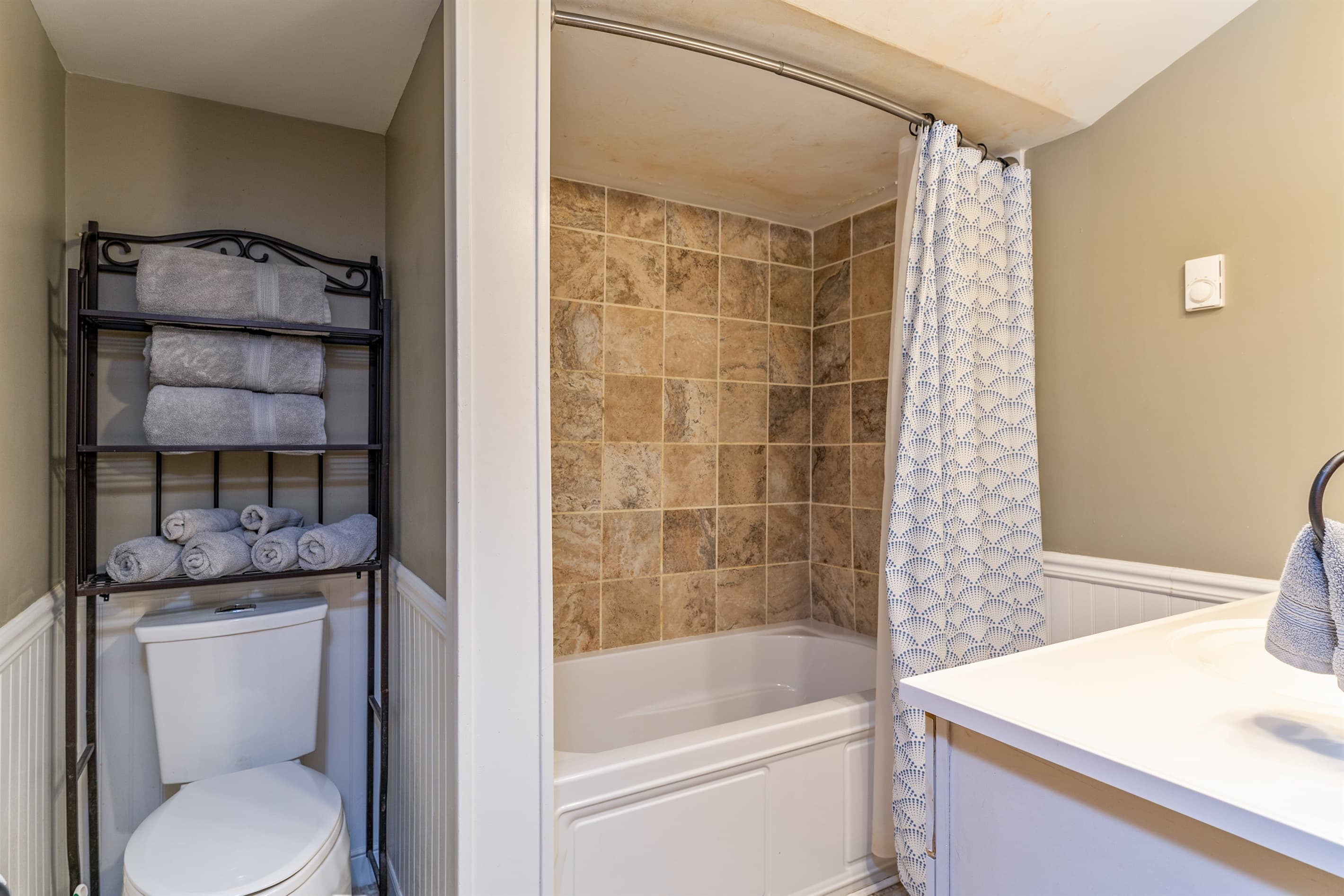 Full bathroom with tub and shower combination