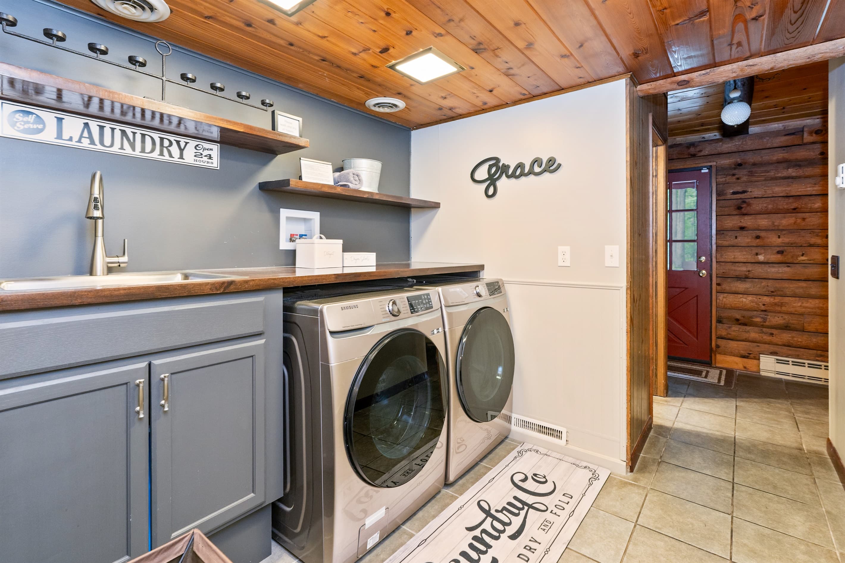 Laundry area with a sink, washer and dryer