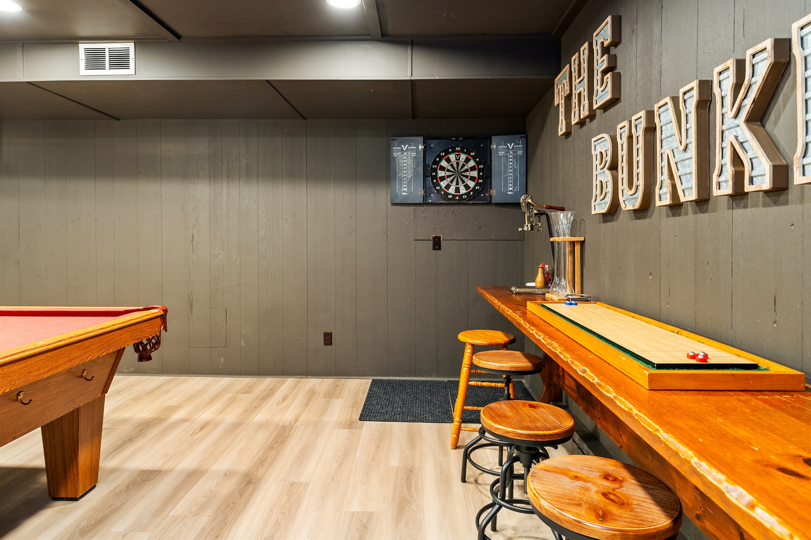Basement game area with shuffleboard table