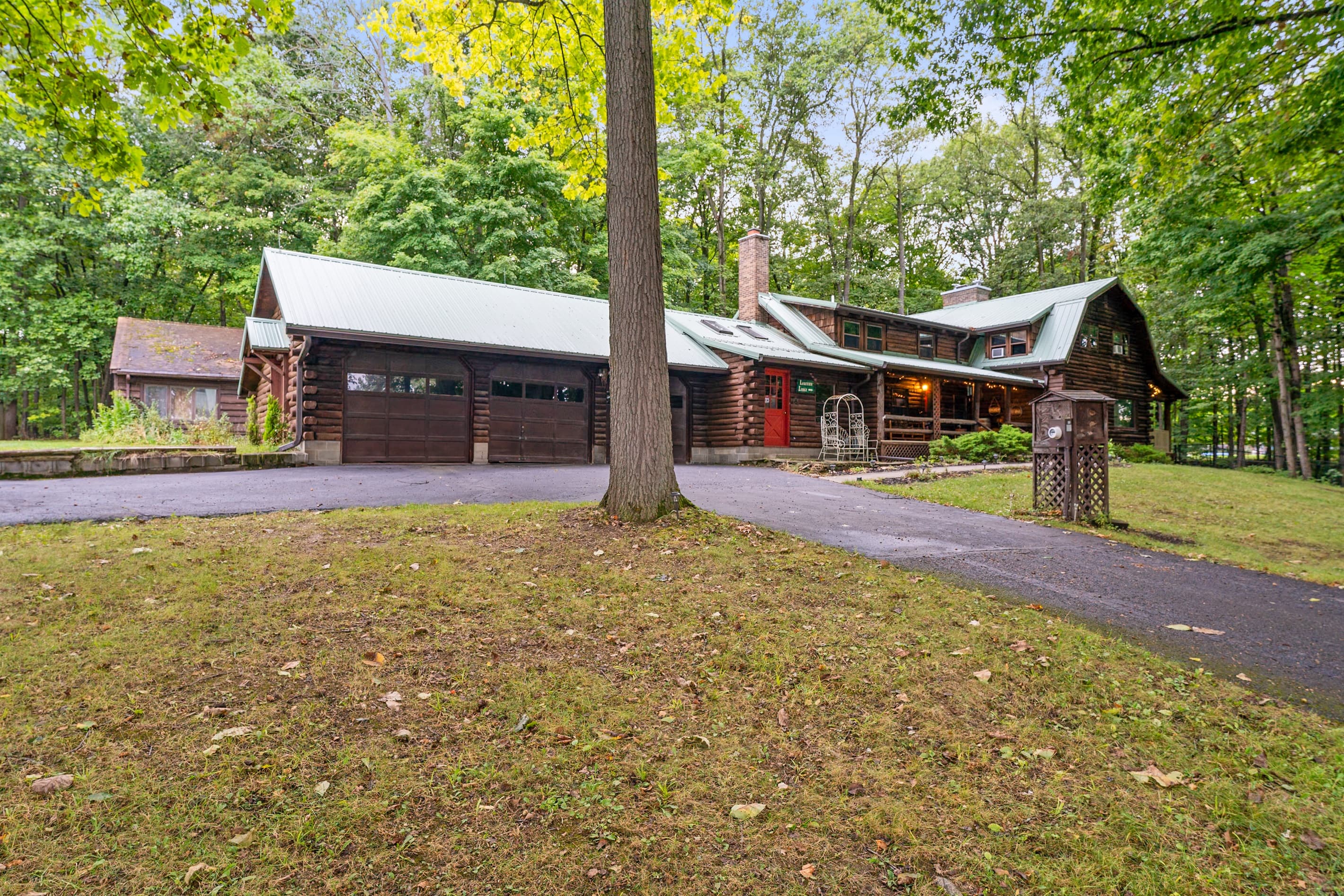 Cabin grounds with driveway and covered parking