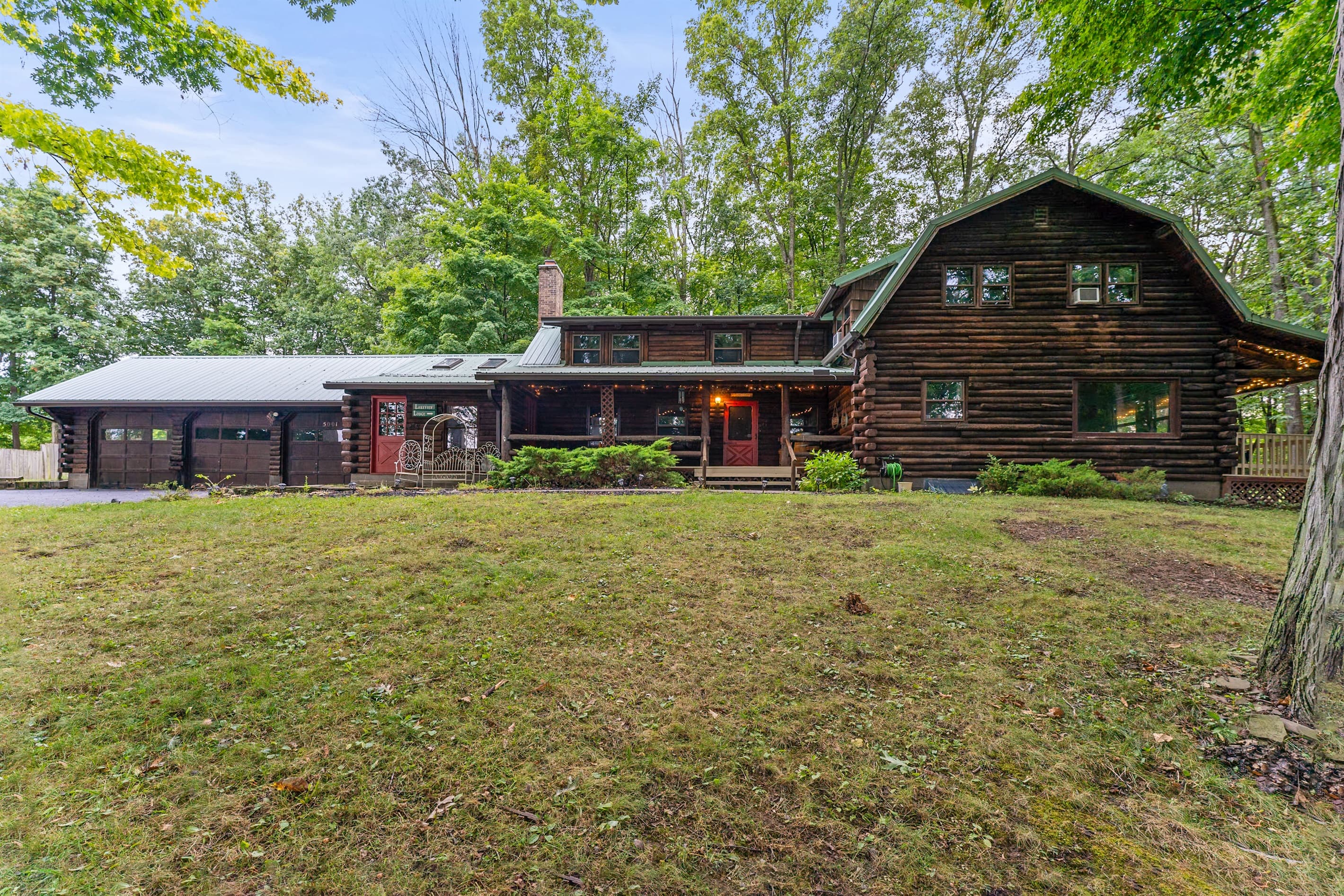 Wide exterior view of the log cabin