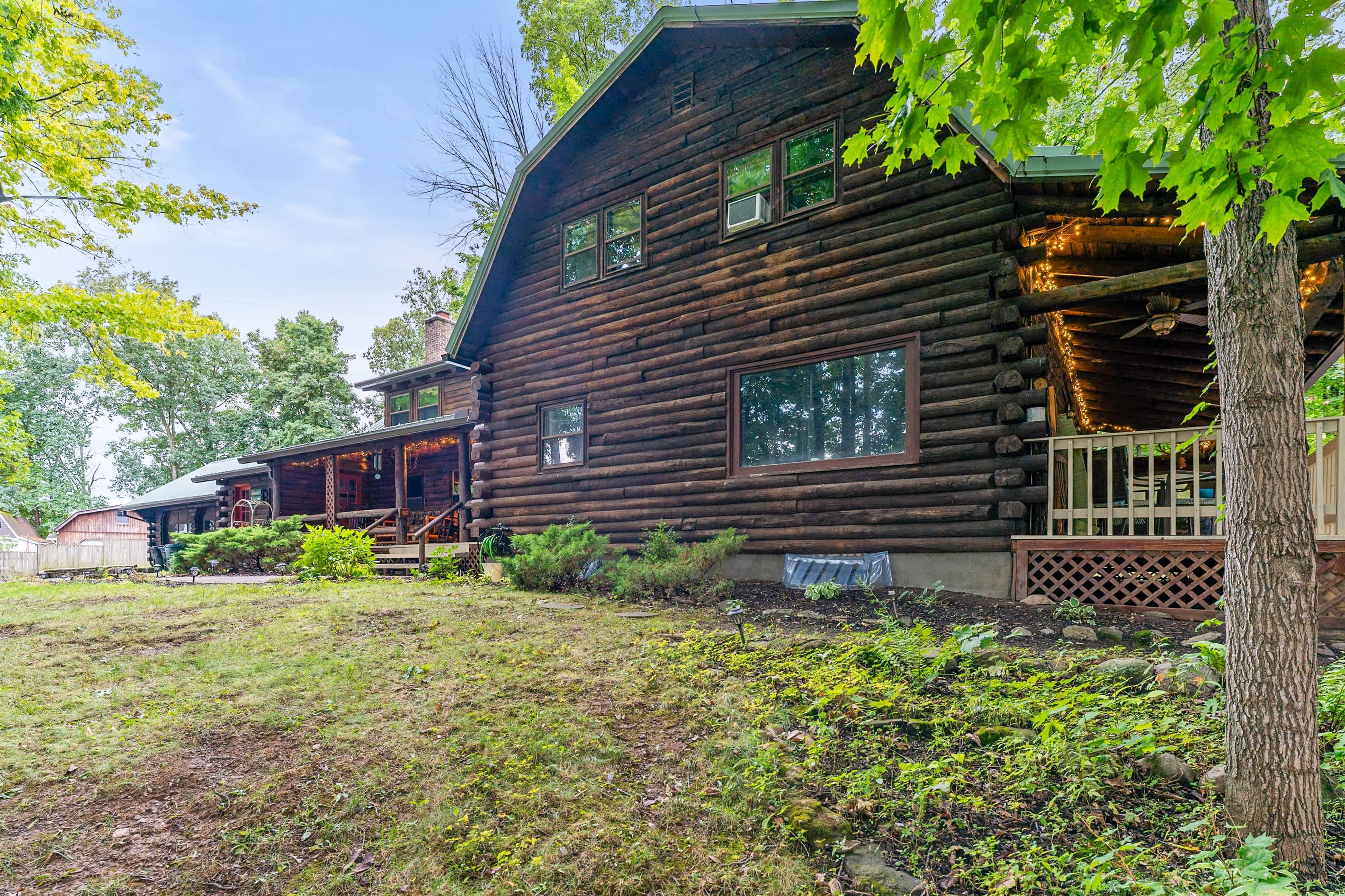Side exterior surrounded by mature trees