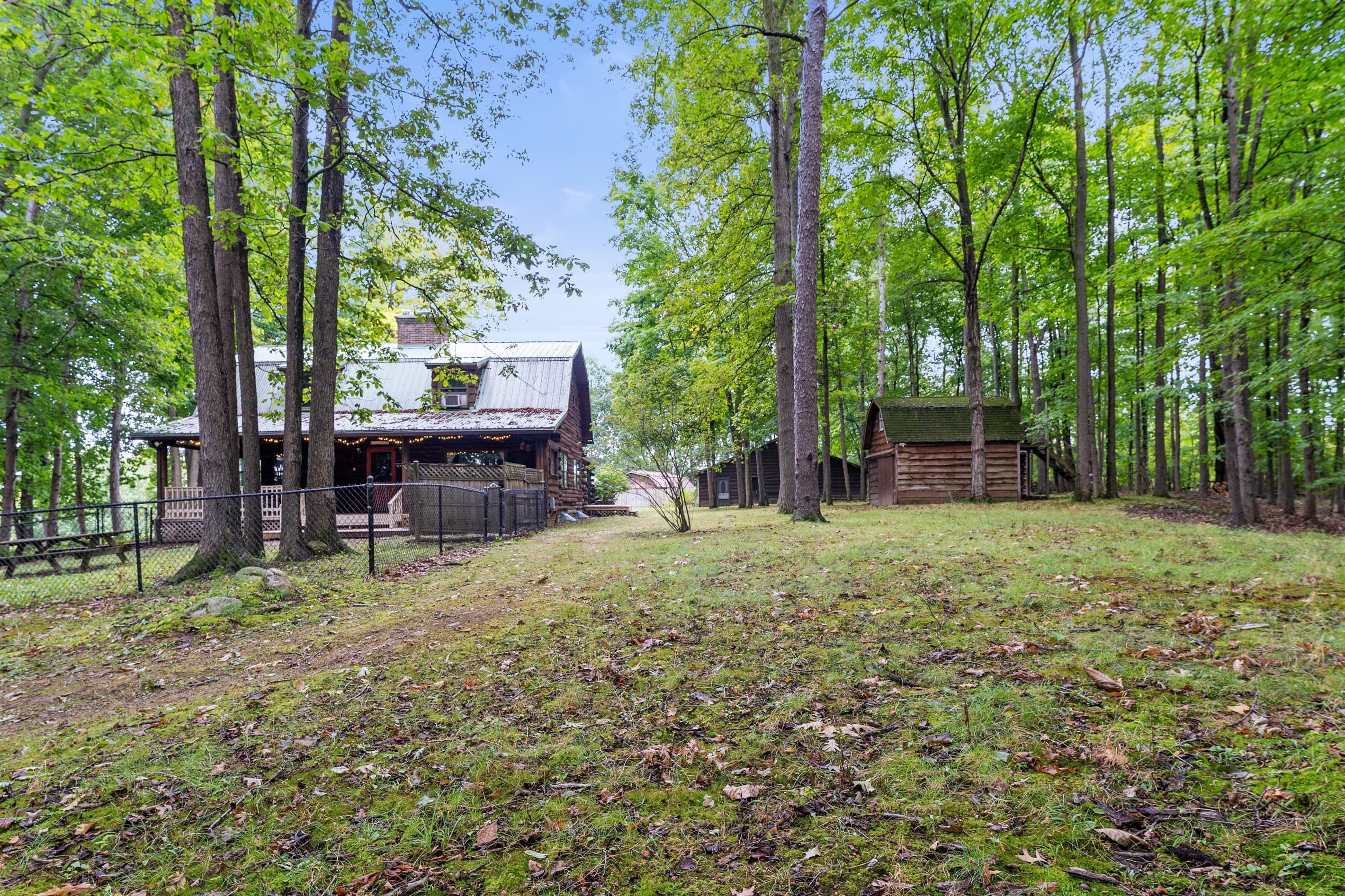 Wooded pavilion set apart from the cabin