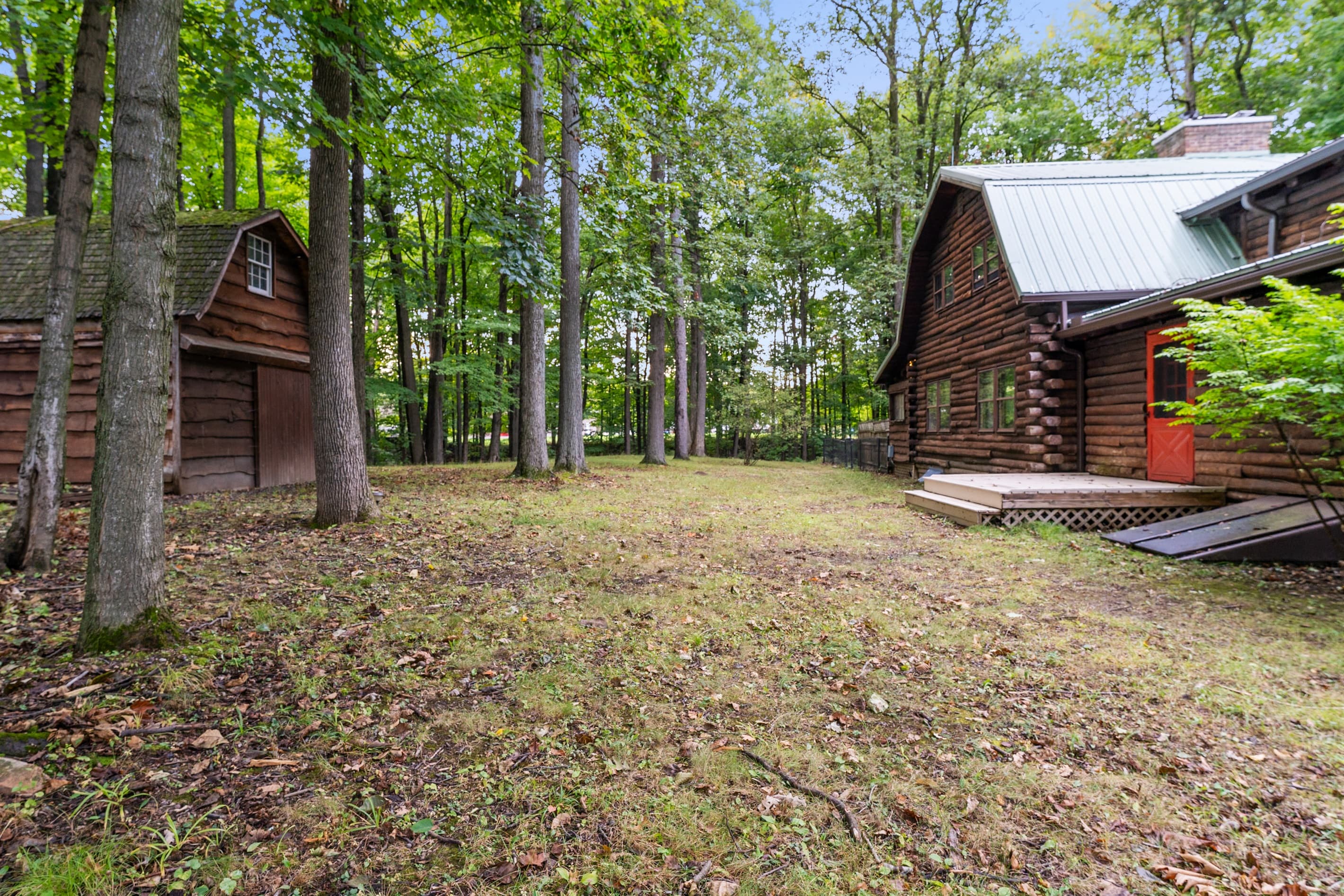 Broad lawn between the cabin buildings