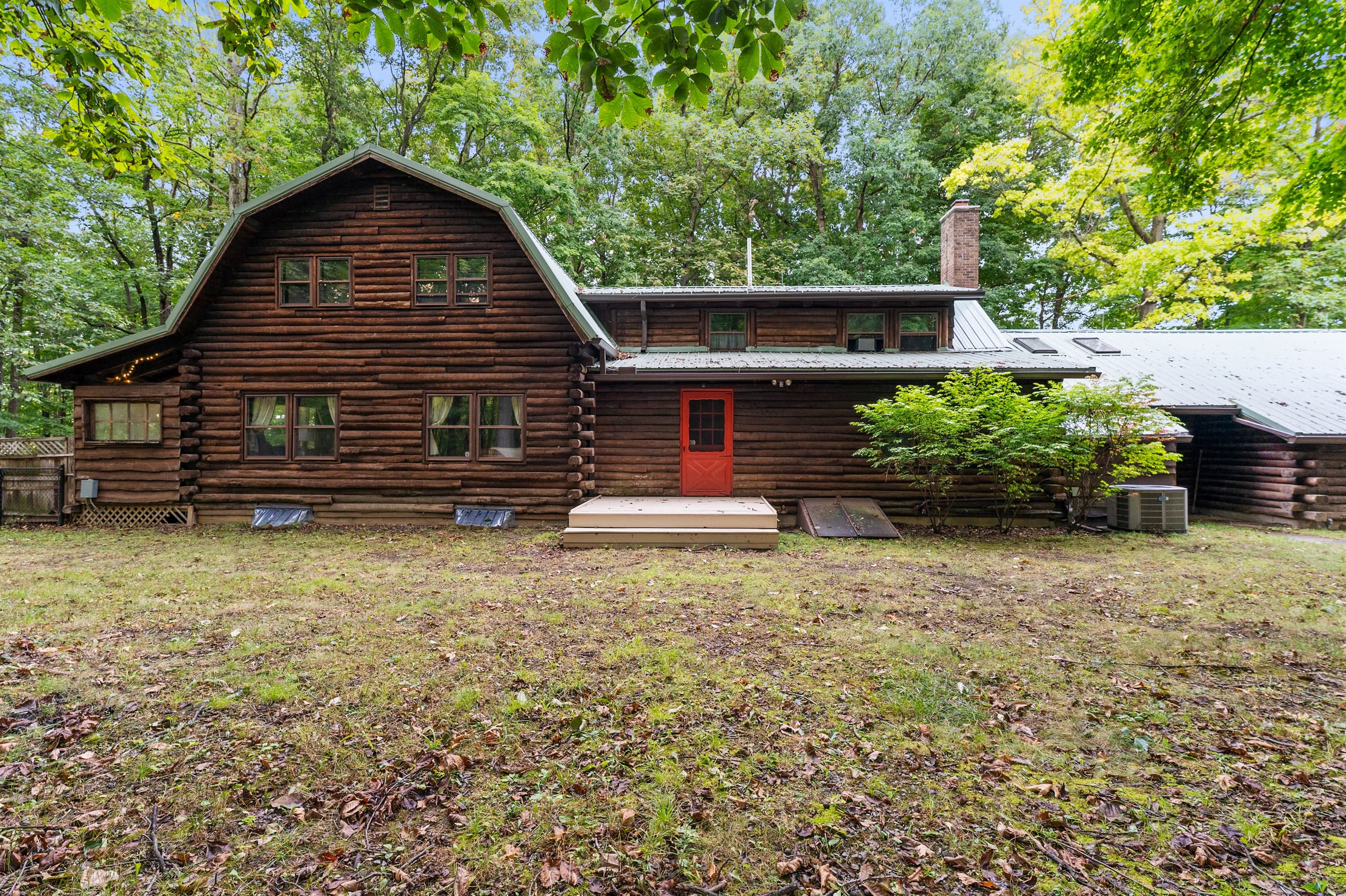 Front exterior of the rustic log cabin