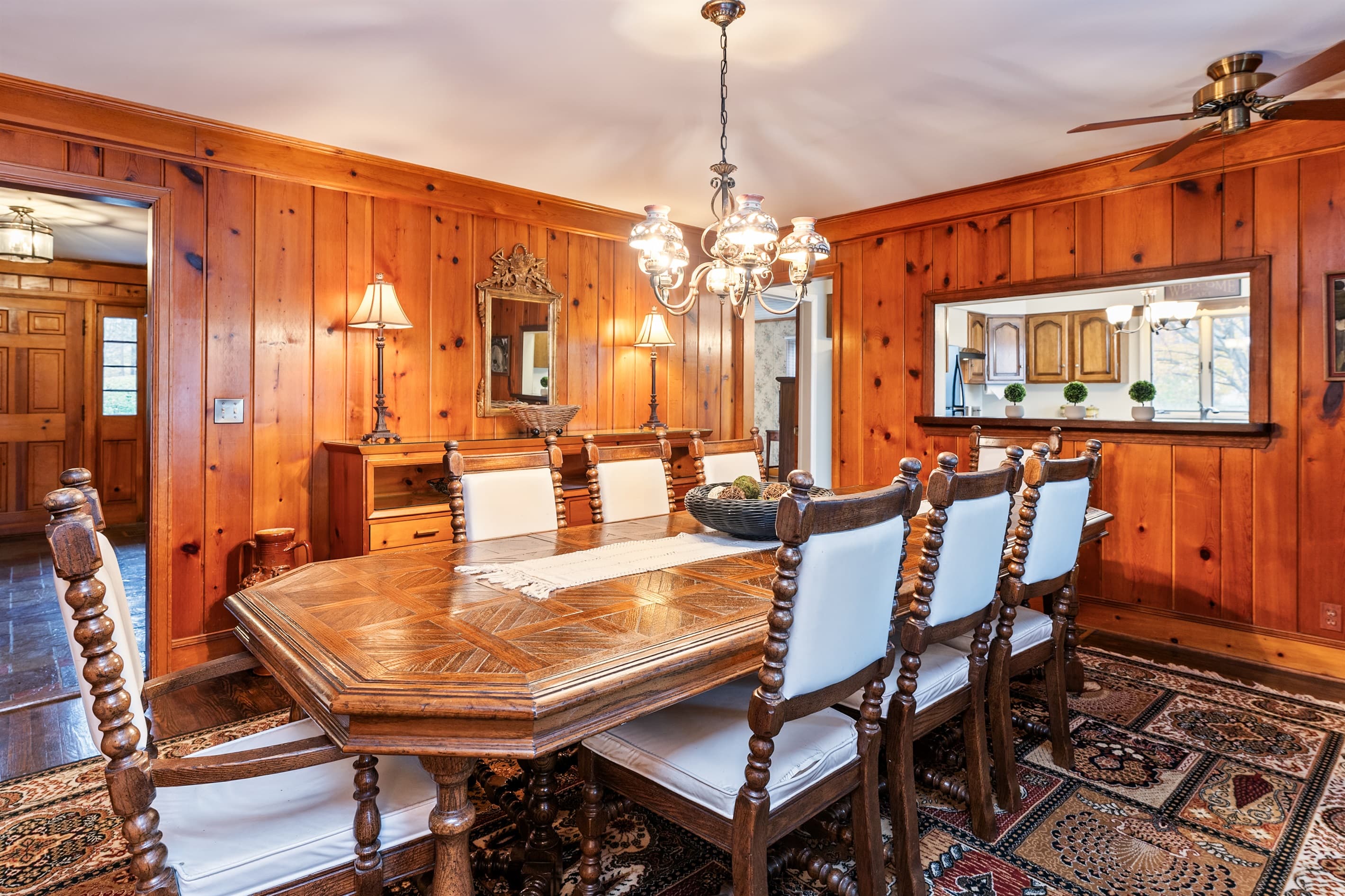 Wood-paneled dining room with vintage table